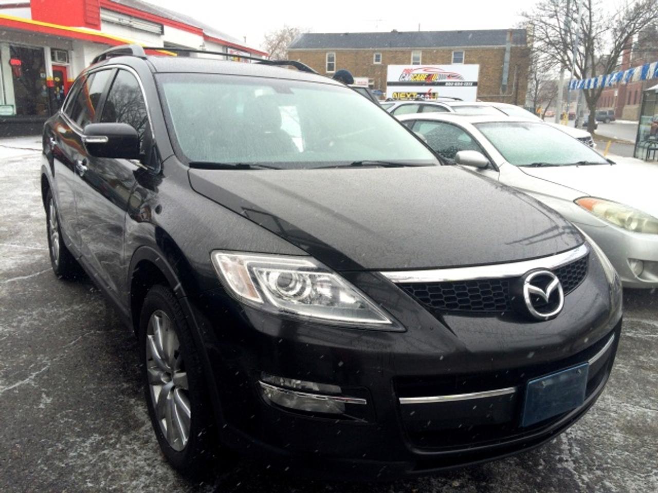 7-passenger!! AWD! Leather! 2 DVD Players!! Fully-loaded!!! Certified, e-tested, 2-year powertrain warranty ($3,000 per claim), 2 years free oil changes (up to $400 value). CarProof available https://reports.carproof.com/main?id=1YRM78MSfAe5X4S78foFURecfkoMO06d 

Spirited motoring while able to haul seven in three seats -- the Holy Grail of crossovers. Quick takeoffs with just a little exhaust rumble for the sound of performance. Cruising is whisper quiet.  Full of energy, the 3.7-litre engine unleashes 273-hp and 270 foot-pounds of torque, and teamed with a smooth and quiet 6-speed automatic with manual mode.  

The CX9 has a power hatch lid that can be activated by the key fob or a button in the dash, and a blind spot monitor  a flashing yellow light in the sideview mirrors if a vehicle is in your blind spot.  Four-wheel independent suspension minimizes road harshness. Though long, wide and shaped somewhat like a minivan, the CX-9 maneuvers into and out of tight places with serpent-like precision. No lean or sway. The 20-inch, low-profile radials are designed for enthusiastic driving.  To ensure optimum road manners under all conditions, stability and traction control with rollover sensing are standard. They will keep the vehicle on even keel or deploy the side-curtain bags spanning all three rows if the driver tries to defy the laws of physics.

YOUR NEIGHBOURHOOD CAR DEALER!!!

At Next Car 4 U we start with YOU, the customer, not with our inventory. Our goal is to help find you a car that gives YOU the best value for YOUR money. Our partnership with Pro Car Care 4 U also gives us a unique opportunity to provide you with extended service and support. 

CarFax and/or CarProof and insurance claim reports provided for all our vehicles. Each vehicle is carefully inspected for safety, mechanical and functionality of all features. Call 289-362-2200 today!