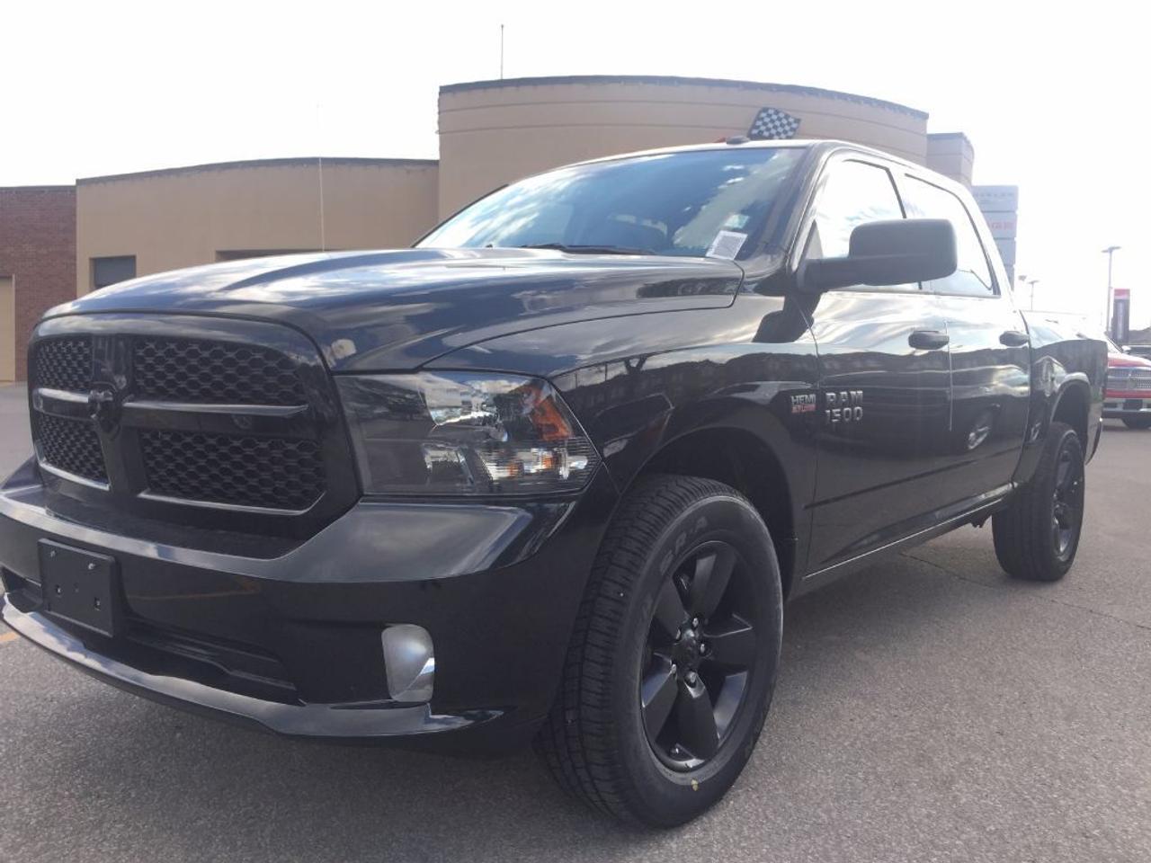 **2017 RAM 1500 CREW CAB EXPRESS 4X4. THIS TRUCK IS EQUIPPED WITH A 5.7L HEMI ENGINE, 6 SPEED AUTOMATIC TRANSMISSION, BLACK EXPRESS GROUP, BLACK HEADLAMP BEZELS, CLASS IV HITCH, BLACK WHEELS, SATELLITE RADIO, HANDS FREE COMMUNICATION BODY COLOR BUMPERS, DUAL EXHAUST TIPS, REMOTE USB PORT, FLAT BLACK BADGING. FOG LAMPS AND MORE. VEHICLE LOCATE AT ROADSPORT CHRYSLER 2851 EGLINTON AVENUE EAST, 416-264-2501. FORMER COMPANY DEMO.