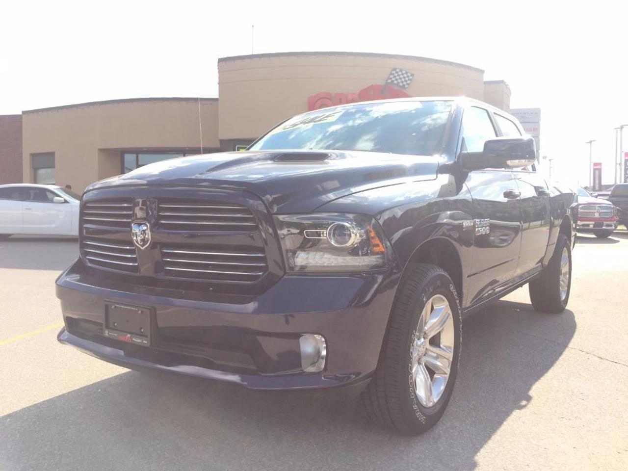 ** Look at this low kms on this 2017 Ram, Save over new!!2017 Ram 1500 Sport Crew Cab. This vehicle is equipped with the legendary 5.7L hemi engine mated to an 8 speed automatic transmission. This 1500 Crew Cab Sport is also equipped with dual exhaust tips, sport performance hood, Parkview rear camera, and MDS (fuel saving technology)power windows, power locks, 2 keys, owners manuals and much more. Vehicle located at Roadsport Chrysler 2851 Eglinton Avenue East, 416-264-2501. FORMER COMPANY DEMONSTRATOR.