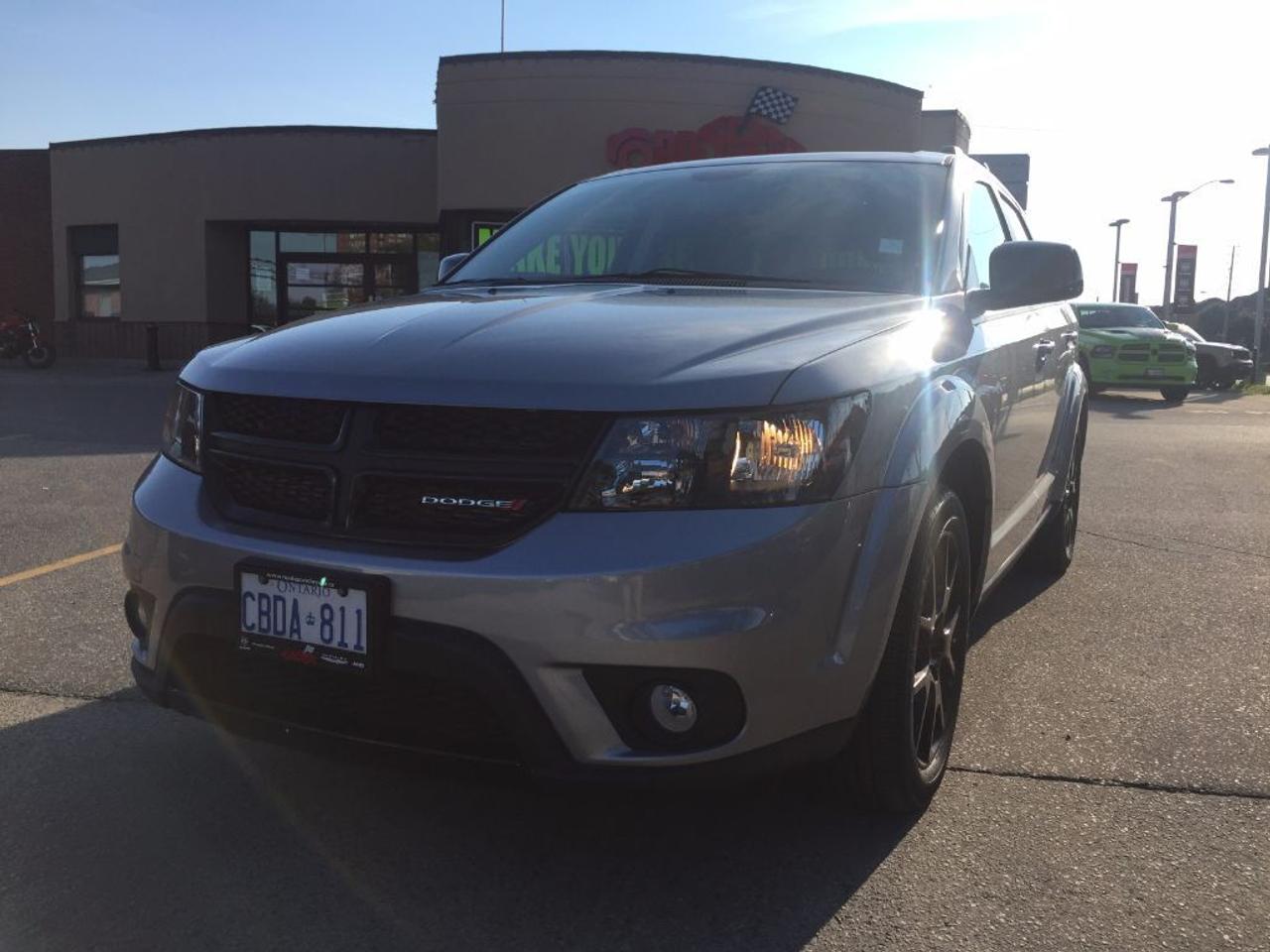 **2016 DODGE JOURNEY SXT 3.6L V6 ENGINE, BLACKTOP PKG. BLUETOOTH, 7 PASSENGER SEATING, 8.4 TOUCH SCREEN RADIO, 19 BLACK ALLOY WHEELS, FOG LIGHTS, TILT, TELESCOPIC STEERING WHEEL. HEATED FRONT SEATS, POWER DRIVERS SEAT, PUSH BUTTON START, PROXIMITY KEY, REMOTE START. FORMER DEALER DEMONSTRATOR. CLEAN CARPROOF AND 2 SETS OF KEYS.