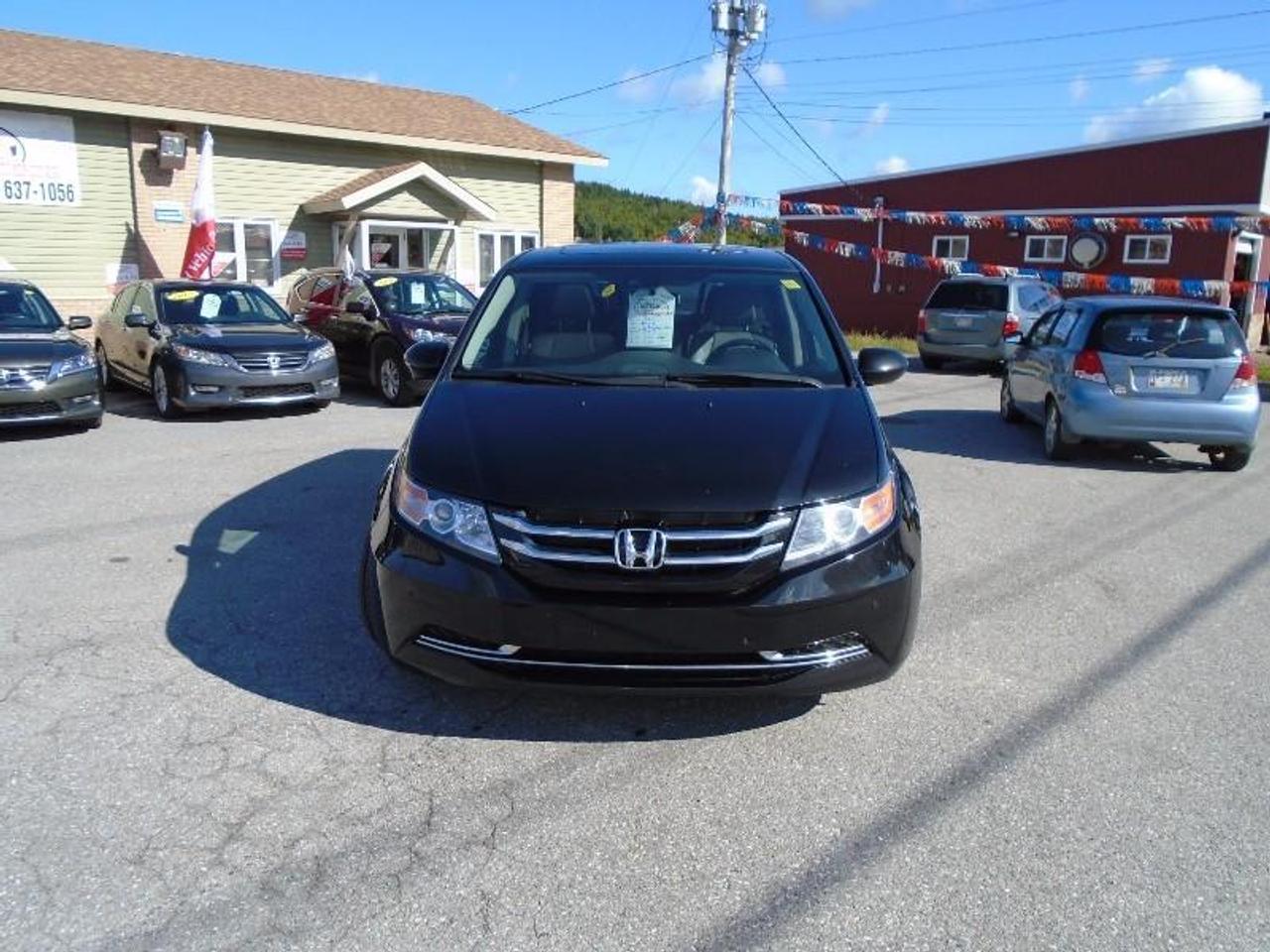 <p>LOCATED AT <a href=http://http//www.fairwayhonda.com rel=external>Fairway Honda</a> 30 Confederation Drive Corner Brook A2H-6T2 (709) 634-8881 1 (877) 373-5681 THIS AWARD WINNING 2014 HONDA ODYSSEY EX-L IS LOADED WITH ALL THE CREATURE COMFORTS INCLUDING POWER REAR LIFTGATE, POWER SLIDING DOORS, HEATED LEATHER SEATS, POWER DRIVERS SEAT AND POWER PASSENGER SEAT, AIR CONDITIONING, REAR HEAT & AIR, NAVIGATION, REARVIEW BACK UP CAMERA, LANE DEPARTURE WARNING SYSTEM AND MUCH MUCH MORE!! Remainder of Factory Warranty.</p>