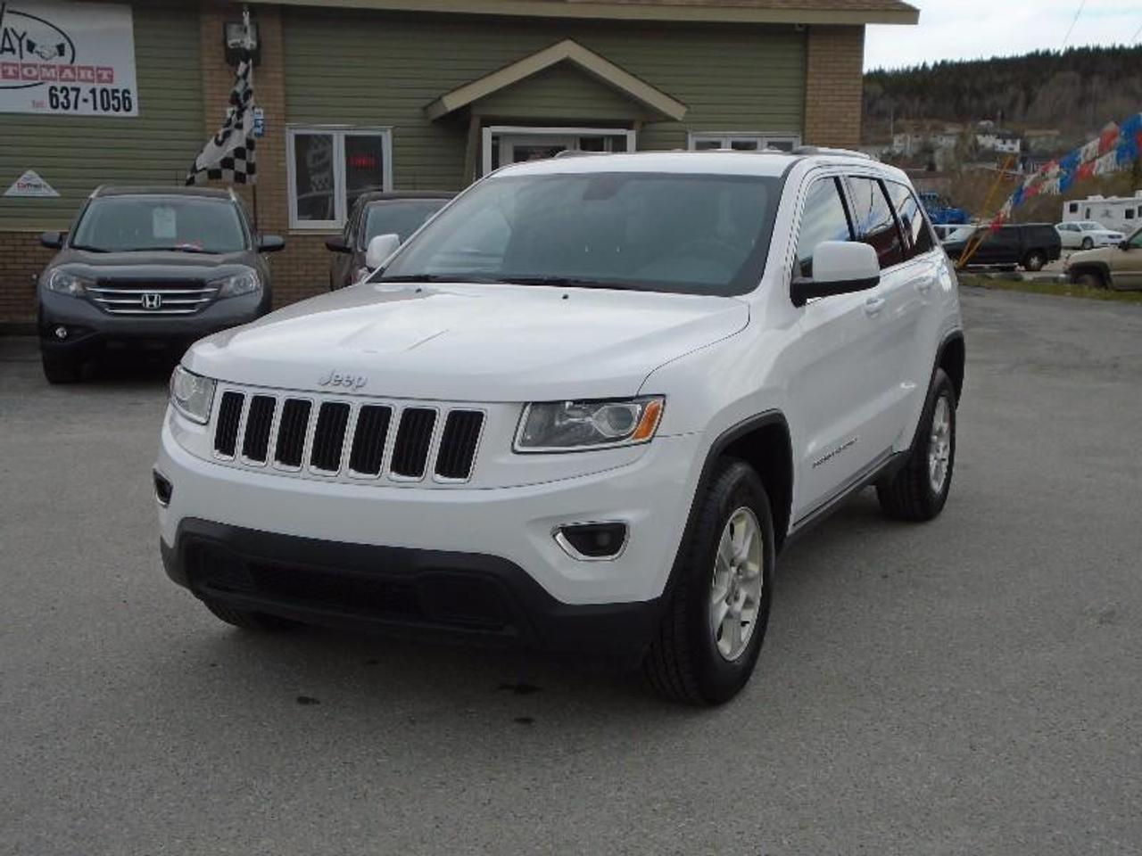 LOCATED AT
<a href=http://http://www.fairwayhonda.com rel=external>Fairway Honda</a>
30 Confederation Drive
Corner Brook  A2H-6T2
(709) 634-8881
1 (877) 373-5681

White 2015 Jeep Grand Laredo 4X4 with paddle shift, dual climate control, full power group, leather wrapped steering, push button start, keyless entry, power seat, cruise, Sirius XM radio, digital compass, Bluetooth, alloy wheels and tinted windows and so much more! Like new condition and very low mileage! Be sure to ask about our flexible financing programs with the best rates in the province!