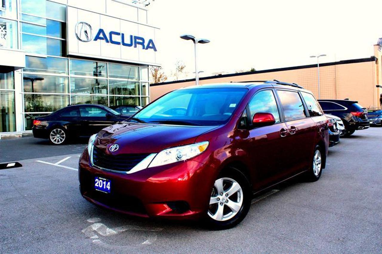 Locally owned, low kilometer, brilliant red 2014 Toyota Sienna LE.  Dont miss this rare chance to own a very slightly used Toyota Sienna LE.  Our factory trained technicians completed a 150 point inspection, a full detail, and the service is up to date.  Presenting our outstanding 2014 Toyota Sienna LE 7 Passenger Moblity thats eye-catching in Red. Under the hood, an efficient team comprised of a powerful 3.5 Liter V6 tethered to a seamless 6 Speed Automatic transmission generates 266hp and rewards you with 7.9L/100km on the open road. With a smooth ride that is low on road noise, youll set the stage for a serene trip with your family in this Front Wheel Drive Minivan.The aerodynamic exterior of the Sienna LE is accented by alloy wheels, a roof rack and child-friendly dual power sliding doors. Inside, youll immediately notice the great visibility and that the distinctive swept shape of the dashboard makes the spacious cabin feel even roomier. The ergonomically designed seats offer power lumbar support to keep you comfortable on those long trips and with three-zone automatic climate control, everyone will be content. Thoughtfully designed with your hectic schedule in mind, our LE also has a central display with hands-free phone capability and music streaming via Bluetooth, available satellite radio and an iPod interface. Of course, youll have ample cargo space for all of your familys gear so enjoy your trip.This responsibly built minivan has anti-lock disc brakes, stability and traction controls, and plenty of airbags to safeguard you and your family. Anyone who says minivans arent cool hasnt been behind the wheel of our Sienna! Print this page and call us Now... We Know You Will Enjoy Your Test Drive Towards Ownership! The Dilawri Group of Companies is Canadas largest automotive group. We are proud to offer exceptional products and customer service in every dealership. We stay active locally and Dilawri Foundation has been helping communities since 2002. $495 Documentation Fee and $295 Tire and Rim Insurance is additional.