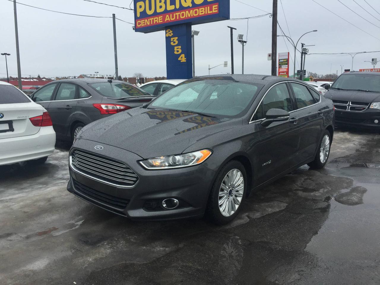 <a href=https://www.autopublique.ca/occasion/Ford-Fusion-2016.html>https://www.autopublique.ca/occasion/Ford-Fusion-2016.html</a>

FORD FUSION 2016 SE HYBRIDE *** MODELE RARE SUR LE MARCHÉ *** CUIR, CAMERA DE RECUL, AUTOMATIQUE...economie essence incroyable !!! Jamais accidenté (carproof a lappui)

Ce vehicule est situé au 2354 Cure Labelle a Chomedey (Laval), en face du Adonis et Jean Coutu et Dollorama.

Nos sites situés à Laval et Mirabel vous offrent tous les soins requis pour votre nouveau véhicule sous un même toit : Mécanique  à taux réduit si vous achetez un véhicule chez nous, des rabais sur lesthétique ainsi la teinte de vitres, débosselage sans peinture, carrosserie, remplacement de pare-brise et bien plus.

Tous nos véhicules ont un rapport dinspection détaillé, sont soigneusement préparés.

Nous vous offrons le financement 1ère, 2ème et 3ème chance au crédit ainsi que la politique du meilleur prix garanti !
Approbation rapide par notre site web autopublique.ca ou par telephone. 1ere, 2e, 3e chance au credit. Aucun cas refusé. Dépot peut être requis dans certains cas.
Osez comparer. Avant dacheter venez rencontrer notre personnel dynamique dans un environnement sans pression. Notre mission est de vous trouver le véhicule de votre choix, selon vos critères ! Si nous ne lavons pas, nous pouvons vous le trouver ! Frais de préparation en sus
Les deux commerces étant situé sur Cure Labelle, notre accessibilité est facile et rapide.Par lautoroute 440, autoroute 640, autoroute 15 et autoroute 13. Tous les chemins mènent a Auto Publique. Avec vous, sur la route de la vie !

Nous vendons et achetons toutes les marques de vehicules, dont Audi, BMW, Chevrolet, Chrysler, Ford, GM, GMC, Hyundai, Kia, Honda, Fiat, Smart, Mercedes, Mercedes Benz, Toyota, Range Rover, Land Rover, Volvo, Volkswagen, et encore plus.

Se habla Español !