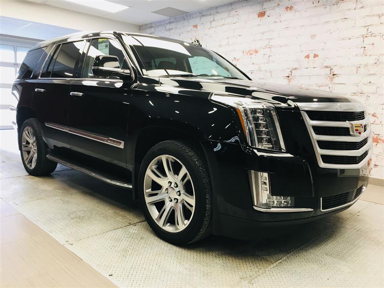 <a href=https://www.2riveschrysler.com/occasion/Cadillac-Escalade-2015.html>https://www.2riveschrysler.com/occasion/Cadillac-Escalade-2015.html</a>

***CADILLAC ESCALADE PREMIUM 2015*** UN MOT...IMPECCABLE! **JAMAIS ACCIDENTÉ!** WOW! 4X4! ABSOLUMENT TOUT ÉQUIPÉ! LOOK ÉCOEURANT! REPRIS DIRECTEMENT DU CONCESSIONNAIRE! RAPPORT DINSPECTION COMPLET ET CARPROOF EN MAIN! ; UN SEUL PROPRIÉTAIRE! MAGS 22 POUCES! LE MIX DE COULEUR RÊVÉ! DVD POUR DIVERTIR LES ENFANTS! GROUPE ÉLECTRIQUE, CLIMATISATION BI-ZONE, SIÈGES CHAUFFANTS AVANTS/ARRIÈRES, SIÈGES VENTILÉS, SIÈGES MÉMOIRE, NAVIGATION / GPS, CAMÉRA DE RECUL, AJUSTEMENT DE PÉDALE ET VOLANT ÉLECTRIQUE! EN PRIME, ON VOUS DONNE MÊME VOS 3 PROCHAINS CHANGEMENTS DHUILE DIRECTEMENT AU CONCESSIONNAIRE CADILLAC! POURQUOI ALLER AILLEURS QUAND CEST AU MEILLEUR PRIX SUR LE MARCHÉ? À VOIR!  POUR PRENDRE RENDEZ-VOUS POUR UN ESSAI ROUTIER OU POUR OBTENIR PLUS DE DÉTAILS, VOUS POUVEZ COMMUNIQUER SANS FRAIS AU : 1-877-356-0744 ET VIA TEXTO OU CELLULAIRE AVEC PHILIPPE AU 1450-517-0857 OU SAMUEL AU 1450-780-2709 EN TOUT TEMPS, LES SOIRS ET MÊME LE WEEK-END!  TOUJOURS PARMIS LES MOINS CHERS AU CANADA!  Deux Rives Occasion est situé à moins de 45 minutes de Montréal, 30 minutes de Drummondville, St-Hyacinthe, Beloeil!  Votre nouveau véhicule vous sera vendu avec une certification CarProof et une inspection complète.  Rabais de 500$ déjà appliqué sur le prix avec un financement à taux régulier.  Nos reprenons vos véhicules en échange peu importe létat!  Financement disponible sur place; 1ère, 2è et 3è chance au crédit.  Contactez-nous pour prendre rendez-vous et pour faire un essai routier.  À moins de 45 minutes de Montréal, 30 minutes de Drummondville, St-Hyacinthe, Beloeil!  UNE ENTREPRISE FAMILIALE ; EN AFFAIRES DEPUIS PLUS DE 100 ANS  -----------------------------------------------------------------------------------------------------------------------------------  TO GET AN APPOINTMENT FOR A ROAD TEST OR TO HAVE MORE DETAILS, YOU MAY CALL AT: 1-877-356-0744 OR VIA TEXTO OR CELLULAR WITH SAMUEL AU 1450-780-2709 OR PHILIPPE AU 1450-517-0857 AT ALL TIMES, EVENINGS AND EVEN THE WEEKEND!   ALWAYS THE BEST DEAL IN CANADA!   Deux Rives Occasion is located less than 45 minutes from Montreal, 30 minutes from Drummondville, St-Hyacinthe, Beloeil!   Your new vehicle will be sold with a CarProof certification and a full inspection.   $ 500 rebate already applied on price with regular rate financing.   We take back your vehicles in exchange regardless of the condition!   Financing available; 1st, 2nd and 3rd chance to credit.   Contact us for an appointment and a test drive.   A FAMILY BUSINESS ; IN BUSINESS FOR OVER 100 YEARS