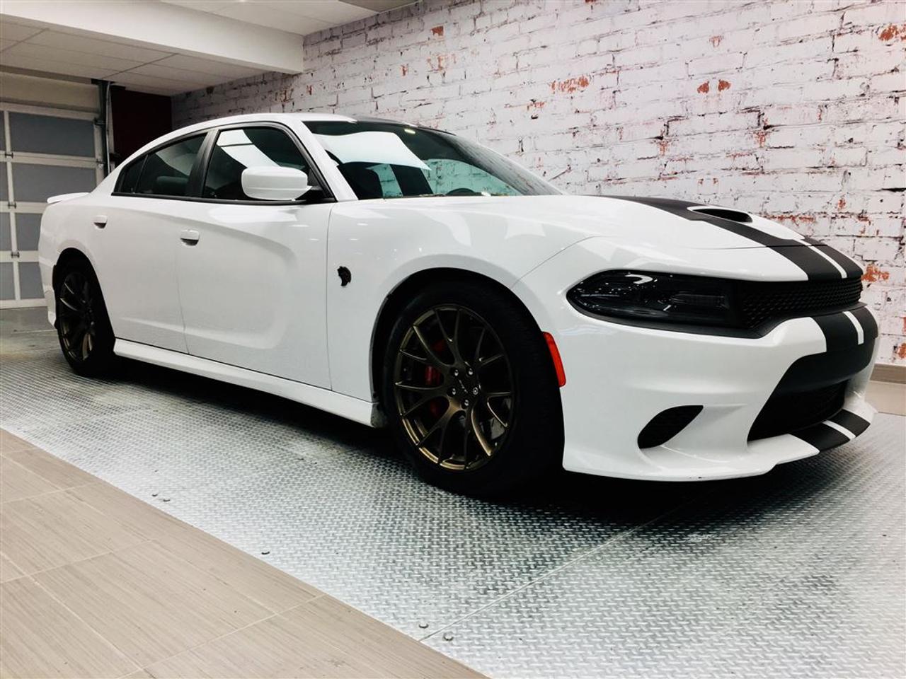 <a href=https://www.2riveschrysler.com/occasion/Dodge-Charger-2017.html>https://www.2riveschrysler.com/occasion/Dodge-Charger-2017.html</a>

***DODGE CHARGER SRT HELLCAT 2017*** UN SEUL MOT... WOW! VEHICULE DU BOSS! **JAMAIS ACCIDENTÉ** RAPPORT INSPECTION ET CARPROOF EN MAIN! UN SEUL PROPRIETAIRE! PUISSANCE INCOMPARABLE DE 707HP! CONDUITE INCROYABLE! UNE BOMBE! TOIT OUVRANT, NAVIGATION, MAGS 20, INTÉRIEUR 2 TONS, SIÈGES / VOLANT CHAUFFANTS, SIÈGES VENTILÉS ET ENCORE PLUS! UNE AUBAINE À CE PRIX-LÀ! À VOIR! VÉHICULE EN DEMANDE ET TRÈS RARE!         POUR PRENDRE RENDEZ-VOUS POUR UN ESSAI ROUTIER OU POUR OBTENIR PLUS DE DÉTAILS, VOUS POUVEZ COMMUNIQUER SANS FRAIS AU : 1-877-356-0744 ET VIA TEXTO OU CELLULAIRE AVEC SAMUEL AU 1450-780-2709 OU ERIK AU 1514-978-9820 OU PHILIPPE AU 1450-517-0857 EN TOUT TEMPS, LES SOIRS ET MÊME LE WEEK-END!        TOUJOURS PARMIS LES MOINS CHERS AU CANADA!        Deux Rives Occasion est situé à moins de 45 minutes de Montréal, 30 minutes de Drummondville, St-Hyacinthe, Beloeil!        Votre nouveau véhicule vous sera vendu avec une certification CarProof et une inspection complète.        Rabais de 500$ déjà appliqué sur le prix avec un financement à taux régulier.        Nos reprenons vos véhicules en échange peu importe létat!        Financement disponible sur place; 1ère, 2è et 3è chance au crédit.        Contactez-nous pour prendre rendez-vous et pour faire un essai routier.        À moins de 45 minutes de Montréal, 30 minutes de Drummondville, St-Hyacinthe, Beloeil!        UNE ENTREPRISE FAMILIALE ; EN AFFAIRES DEPUIS PLUS DE 100 ANS        -----------------------------------------------------------------------------------------------------------------------------------        TO GET AN APPOINTMENT FOR A ROAD TEST OR TO HAVE MORE DETAILS, YOU MAY CALL AT: 1-877-356-0744 OR VIA TEXTO OR CELLULAR WITH SAMUEL AU 1450-780-2709 OR PHILIPPE AU 1450-517-0857 OR ERIK AU 1514-978-9820 AT ALL TIMES, EVENINGS AND EVEN THE WEEKEND!         ALWAYS THE BEST DEAL IN CANADA!         Deux Rives Occasion is located less than 45 minutes from Montreal, 30 minutes from Drummondville, St-Hyacinthe, Beloeil!         Your new vehicle will be sold with a CarProof certification and a full inspection.         $ 500 rebate already applied on price with regular rate financing.         We take back your vehicles in exchange regardless of the condition!         Financing available; 1st, 2nd and 3rd chance to credit.         Contact us for an appointment and a test drive.         A FAMILY BUSINESS ; IN BUSINESS FOR OVER 100 YEARS