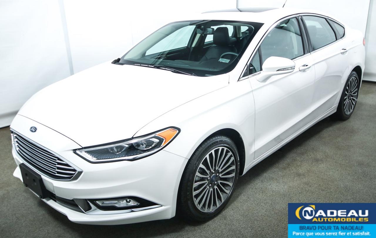 <a href=https://www.autoaubaine.com/Ford-Fusion-c7007614.html>https://www.autoaubaine.com/Ford-Fusion-c7007614.html</a>

AWD, 2 CLÉS, SYSTÈME DE NAVIGATION, TOIT OUVRANT, CAMÉRA DE RECUL, DÉMARREUR À DISTANCE, JANTES EN ALUMINIUM DE 18 POUCES, INTÉRIEUR DE CUIR, SIÈGES ÉLECTRIQUES, CHAUFFANTS ET VENTILÉS, RÉGULATEUR DE VITESSE, BLUETOOTH, PHARES AUTOMATIQUES, VERROUILLAGE SANS CLÉ, CLIMATISATION, GROUPE ÉLECTRIQUE. GARANTIE COMPLÈTE DE FORD JUSQUAU 19 AOUT 2019 OU 60000KM ET MOTOPROPULSEUR JUSQUAU 19 AOUT 2021 OU 100000KM. FORD FUSION TITANIUM 2017 À VENDRE À SAINT-JEAN-SUR-RICHELIEU.NADEAU AUTOMOBILES a une solide réputation et tout le personnel est orienté vers la satisfaction à la clientèle. Financement rapide et facile pour 2ième et 3ième chance au crédit. Notre téléphone pour un représentant 1-855-248-3268 ou notre service web personnalisé et par cellulaire 7 jours/7 438-800-4410. Visitez www.nadeauautomobiles.com