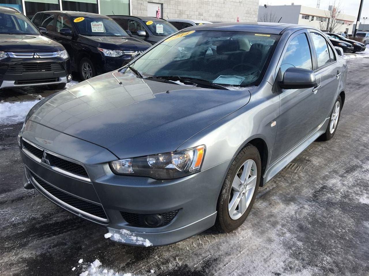 <a href=https://www.action-mitsubishi.com/occasion/Mitsubishi-Lancer-2014.html>https://www.action-mitsubishi.com/occasion/Mitsubishi-Lancer-2014.html</a>

BALANCE DE GARANTIE 10 ANS/160 000KM* UN SEUL PROPRIÉTAIRE! TOIT OUVRANT, Sièges Chauffants, AILERON, Régulateur de Vitesse, PHARES ANTI-BROUILLARD, Air Climatisé, JANTES EN ALLIAGE DE 16 POUCES, Radio CD/MP3/USB + Commande Audio au Volant + Bluetooth 2.0, MIROIRS ÉLECTRIQUES ET CHAUFFANTS, Vitres Électriques, TÉLÉ-DÉVERROUILLAGE ET BIEN PLUS +++ À NE PAS MANQUER! **OUVERT LE SAMEDI/OPEN SATURDAY**        APPELEZ-NOUS/ CALL US: (450) 443-7330. DE PARTOUT AU CANADA SANS FRAIS/ ANYWHERE IN CANADA FREE OF CHARGE: 1-877-820-2602 VENEZ en faire LESSAI chez ACTION MITSUBISHI à ST-HUBERT (LONGUEUIL), EN MONTÉRÉGIE, SUR LA RIVE-SUD DE MONTRÉAL.     Que ce soit pour un véhicule utilitaire sport, une mini-fourgonnette, un camion, une convertible (décapotable), une berline, une voiture sport, un coupé 2 portes, un pick-up ou tout autre véhicule, si nous lavons pas en inventaire et bien nous le trouverons pour vous, et ce au meilleur prix du marché comme toujours !!!     Tous nos véhicules sont inspectés, réparés et certifiés CARPROOF. Nous offrons aussi les meilleurs taux dintérêts disponible et 100% dapprobation! Notre service après vente axé sur la satisfaction de nos clients, la qualité de notre personnel, notre transparence et notre professionnalisme ne sont la que 4 autres bonnes raisons de nous faire confiance!     Nous déservons les villes de Beloeil à Longueuil, De Chambly à St-Bruno, De St-Basile à Marieville, De Richelieu à St-Mathias, De Mont-St-Hilaire à Carignan, Le plus gros centre de véhicules doccasion Mitsubishi sur la rive sud de Montréal, à 5 minutes du PONT CHAMPLAIN et JACQUES-CARTIER. Merci de toute léquipe dACTION MITSUBISHI !!! www.action-mitsubishi.com     NOUS PRENONS EN ÉCHANGE TOUTES LES MARQUES COMME ACURA, AUDI, BMW, CADILLAC CHEVROLET, CHRYSLER, DODGE, FIAT, GMC, HONDA, HYUNDAI, JAGUAR, JEEP, KIA, LAND ROVER, MAZDA, MERCEDEZ, NISSAN, SCION, TOYOTA, VOLKSWAGEN ET AUTRE. NOUS PRENONS AUSSI EN ÉCHANGE TOUS LES MODÈLES TELS QUE CIVIC, COROLLA, CRUZE, C250, C300, 350, DART, ELANTRA, FORTE, FOCUS, FRS, GOLF, KOUP, MAZDA 3, SENTRA, TC, 128I, 135I ET AUTRES. Au plaisir de vous servir !!        Come and test drive your next vehicle at ACTION MITSUBISHI in ST HUBERT, on the SOUTH SHORE of MONTREAL. We have the largest inventory of used Mitsubishi vehicles on the South Shore of Montreal . We are located 5 minutes from CHAMPLAIN AND JACQUES-CARTIER BRIDGE. If you do not see what you are looking for in our inventory, let us know and we will find it for you at the cheapest price possible, AS USUAL!     All our cars are INSPECTED, REPAIRED and CARPROOF Certified. We offer the best interest rate available and have a 100% approval rate!     We trade in every brand and model. Please visit us on www.action-mitsubishi.com and on behalf of Action Mitsubishi, thank you for browsing our vehicles.