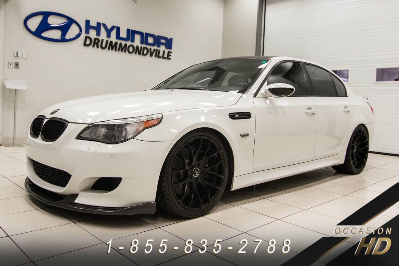 <a href=https://www.hyundaidrummondville.com/occasion/BMW-M5-2006.html>https://www.hyundaidrummondville.com/occasion/BMW-M5-2006.html</a>

BMW M5 2006 ~ EXCELLENT CONDITION / V10 5.0L. DÉVELOPPANT 500 CHEVAUX ET ATTEIGNANT LES 100 KM EN 4.5 SECONDES! PEINTURE ALPINE WHITE + CARBONE PACK + NAVIGATION + DVD ** CE MONSTRE VOUS OFFRE UNE PUISSANCE PHÉNOMÉNALE, UNE CONDUITE DES PLUS SPORTIVE, UN HABITACLE RAFFINÉ TOUT ÉQUIPÉ,... IL INCLUT TOIT OUVRANT, JANTES 20 POUCES BREYTON, PARK ASSIST, SIÈGES CHAUFFANTS AV/AR, SIÈGES SPORTS À MULTI-RÉGLAGES ET FONCTION MÉMOIRE ET BIEN PLUS!! A VOIR ABSOLUMENT!! 

POUR PRENDRE RENDEZ-VOUS POUR UN ESSAI ROUTIER OU POUR OBTENIR PLUS DE DÉTAILS, VOUS POUVEZ COMMUNIQUER SANS FRAIS AU : 1-888-420-3501, VIA MESSAGERIE TEXTE OU APPEL AU 819 314-6555 OU PAR COURRIEL AU USAGE@HYUNDAIDRUMMONDVILLE.CA EN TOUT TEMPS MÊME LES SOIRS ET LES FINS DE SEMAINE !!! PRIX ÉTABLI AVEC UN FINANCEMENT À TAUX RÉGULIER!

NOUS SOMMES LA CONCESSION AU CENTRE DU QUÉBEC !! 1H DE MONTRÉAL   1H DE SHERBROOKE   1H DE TROIS-RIVIÈRES   1H45 DE QUÉBEC !! LE VÉHICULE QUE VOUS RECHERCHEZ À PORTÉ DE MAIN !!

1ERE, 2E ET 3E CHANCE AU CRÉDIT!! AUCUN CAS REFUSÉ!!
FINANCEMENT ET GARANTIE DISPONIBLE SUR PLACE!!
NOUS REPRENONS TOUS VOS ÉCHANGES, MOTO - VTT - BATEAU - ROULOTTE - MOTORISÉ - AVION - QUADRIPORTEUR!!