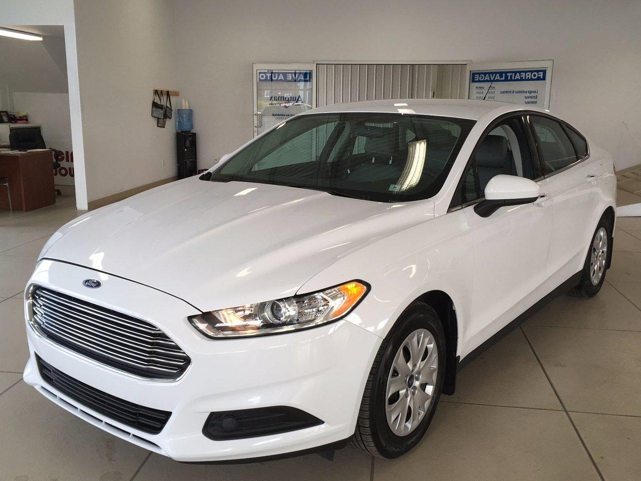 <a href=https://www.poiriernissan.com/occasion/Ford-Fusion-2014.html>https://www.poiriernissan.com/occasion/Ford-Fusion-2014.html</a>

Ford Fusion S  2014Régulateur de vitesse, Essuie-glaces intermittents, Anti-démarreur, Freins ABS, Contrôle de stabilité, Coussins gonflables latéraux, Lecteur CD, Lecteur MP3, Volant ajustable, Enjoliveurs, Tapis protecteurs, Phares automatiques, Rétroviseur électrique, Direction assistée, Coussins gonflables arrière pour la tête, Sièges tissu, Siège conducteur - soutien lombaire, Freins à disque, Antipatinage, Verrous de sécurité pour enfants, Système de surveillance de la pression des pneus, Sièges baquets, Technologie Bluetooth intégrée, Climatisation