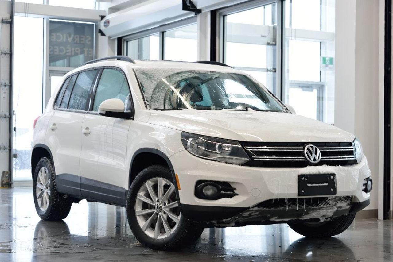 <a href=https://www.vaudreuilvolkswagen.com/occasion/Volkswagen-Tiguan-2014.html>https://www.vaudreuilvolkswagen.com/occasion/Volkswagen-Tiguan-2014.html</a>

Modèle Comfortline, toit panoramique, intérieur en similicuir, air climatisé, Bluetooth, bancs chauffants et roues 17 pouces. Jamais accidenté et un seul propriétaire.    Possibilité dextension de 2 ans ou 40 000 kms de la garantie dorigine avec la certification supérieure Volkswagen    Aucunes obligations bancaires, aucuns frais cachés    Mise en service : 3 décembre 2013