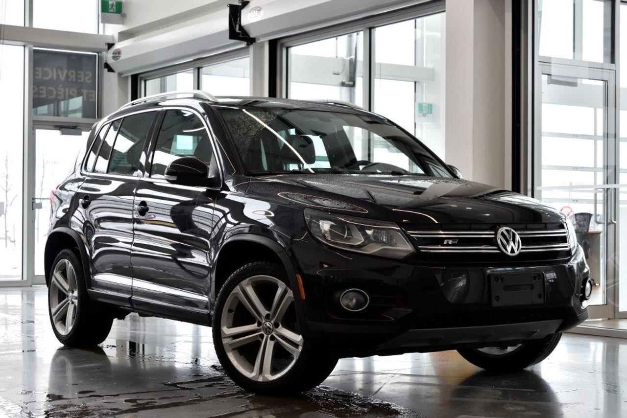 <a href=https://www.vaudreuilvolkswagen.com/occasion/Volkswagen-Tiguan-2014.html>https://www.vaudreuilvolkswagen.com/occasion/Volkswagen-Tiguan-2014.html</a>

Modèle Highline 4motion avec ensemble R-Line. Intérieur en cuir noir, roues 19, Toit panoramique, sièges électriques avec mémoire, lumière automatiques, climatisation deux-zones et essuie-glaces automatiques, volant sport R-line. Jamais accidenté.  Possibilité dextension de 2 ans ou 40 000 kms de la garantie dorigine avec la certification supérieure Volkswagen  Aucunes obligations bancaires, aucuns frais cachés  Mise en service : 14 Mars 2014  Bienvenue chez Vaudreuil Volkswagen!