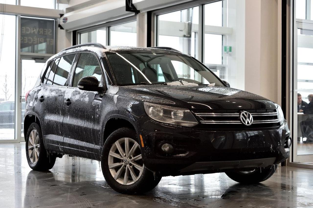 <a href=https://www.vaudreuilvolkswagen.com/occasion/Volkswagen-Tiguan-2014.html>https://www.vaudreuilvolkswagen.com/occasion/Volkswagen-Tiguan-2014.html</a>

Modèle Comfortline équipé de 4motion, toit panoramique, intérieur en similicuir, air climatisé, Bluetooth, bancs chauffants et roues 17 pouces .     Possibilité dextension de 2 ans ou 40 000 kms de la garantie dorigine avec la certification supérieure Volkswagen    Aucunes obligations bancaires, aucuns frais cachés    Mise en service : 2 décembre 2013    Bienvenue chez Vaudreuil Volkswagen!