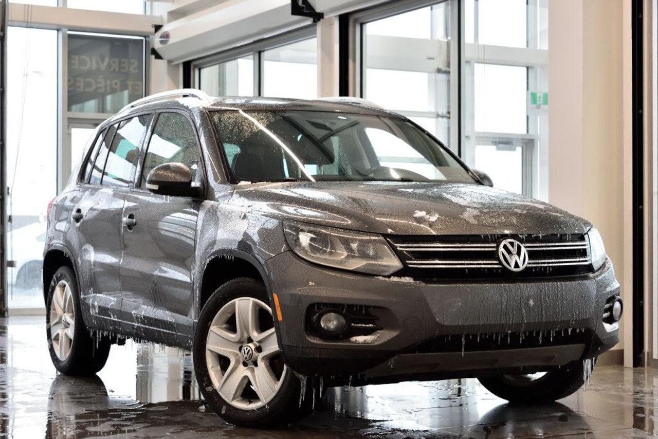 <a href=https://www.vaudreuilvolkswagen.com/occasion/Volkswagen-Tiguan-2014.html>https://www.vaudreuilvolkswagen.com/occasion/Volkswagen-Tiguan-2014.html</a>

Modèle Comfortline 4Motion avec ensemble sport, lumières xénon et DEL, toit panoramique, intérieur en similicuir, air climatisé, Bluetooth, bancs chauffants et roues 18 pouces. Jamais accidenté et un seul propriétaire.        Extension de garantie disponible.        Aucunes obligations bancaires, aucuns frais cachés        Mise en service : 14 mai 2014