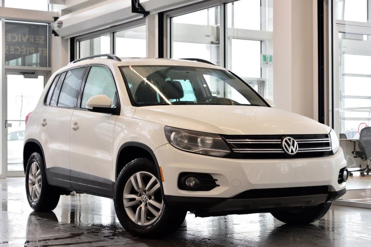 <a href=https://www.vaudreuilvolkswagen.com/occasion/Volkswagen-Tiguan-2014.html>https://www.vaudreuilvolkswagen.com/occasion/Volkswagen-Tiguan-2014.html</a>

Modèle Trendline 4Motion, équipé de Bluetooth, bancs chauffants, air climatisé, roues 16, régulateur de vitesse et miroirs électriques chauffants, phares anti-brouillard. Retour de location, jamais accidenté.  Possibilité dextension de 2 ans ou 40 000 kms de la garantie dorigine avec la certification supérieure Volkswagen  Aucunes obligations bancaires, aucuns frais cachés  Mise en service : 29 Janvier 2014  Bienvenue chez Vaudreuil Volkswagen!