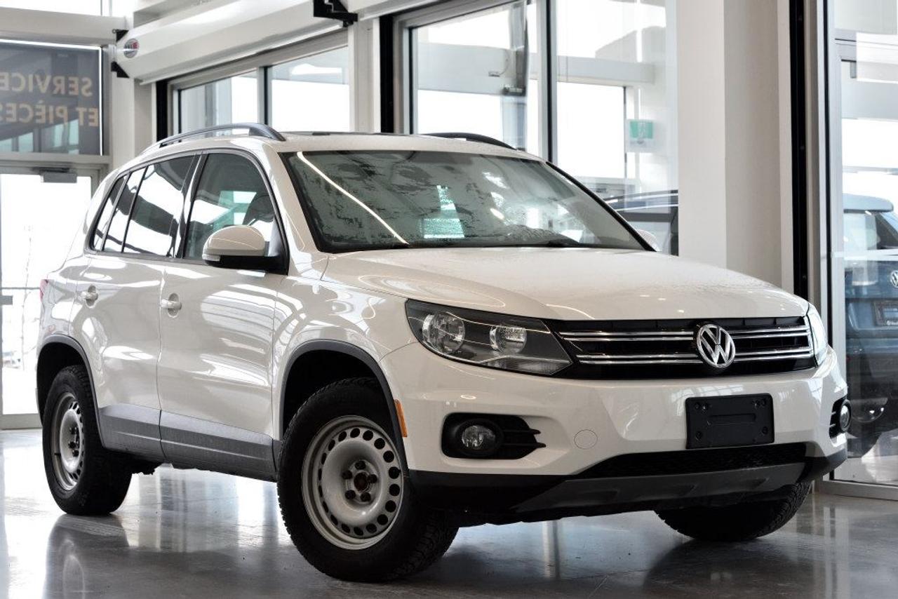 <a href=https://www.vaudreuilvolkswagen.com/occasion/Volkswagen-Tiguan-2014.html>https://www.vaudreuilvolkswagen.com/occasion/Volkswagen-Tiguan-2014.html</a>

Modèle Comfortline équipé de 4motion, toit panoramique, intérieur en similicuir, air climatisé, Bluetooth, bancs chauffants et roues 17 pouces.        Possibilité dextension de 2 ans ou 40 000 kms de la garantie dorigine avec la certification supérieure Volkswagen        Aucunes obligations bancaires, aucuns frais cachés        Mise en service :13 Aout 2013        Bienvenue chez Vaudreuil Volkswagen!