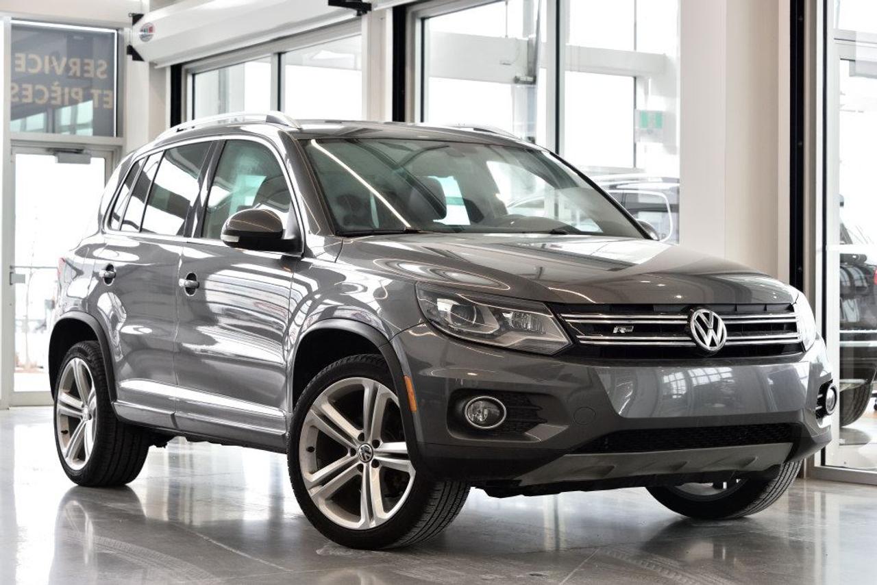 <a href=https://www.vaudreuilvolkswagen.com/occasion/Volkswagen-Tiguan-2014.html>https://www.vaudreuilvolkswagen.com/occasion/Volkswagen-Tiguan-2014.html</a>

Modèle Highline 4motion avec ensemble R-Line. Intérieur en cuir noir, Toit panoramique, sièges électriques avec mémoire, lumières automatiques, climatisation deux-zones et essuie-glaces automatiques, volant sport R-line. Retour de location.        Possibilité dextension de 2 ans ou 40 000 kms de la garantie dorigine avec la certification supérieure Volkswagen        Aucunes obligations bancaires, aucuns frais cachés        Mise en service : 14 Mars 2014        Bienvenue chez Vaudreuil Volkswagen!