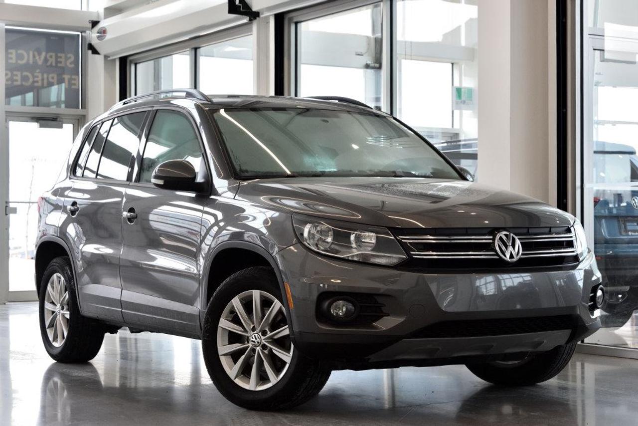 <a href=https://www.vaudreuilvolkswagen.com/occasion/Volkswagen-Tiguan-2015.html>https://www.vaudreuilvolkswagen.com/occasion/Volkswagen-Tiguan-2015.html</a>

Modèle Comfortline 4Motion avec toit panoramique, intérieur en similicuir, caméra de recul, air climatisé, Bluetooth, bancs chauffants et roues 17 pouces . Un propriétaire et jamais accidenté.        Possibilité dextension de 2 ans ou 40 000 kms de la garantie dorigine avec la certification supérieure Volkswagen        Aucunes obligations bancaires, aucuns frais cachés        Mise en service : 30 janvier 2015        Bienvenue chez Vaudreuil Volkswagen!