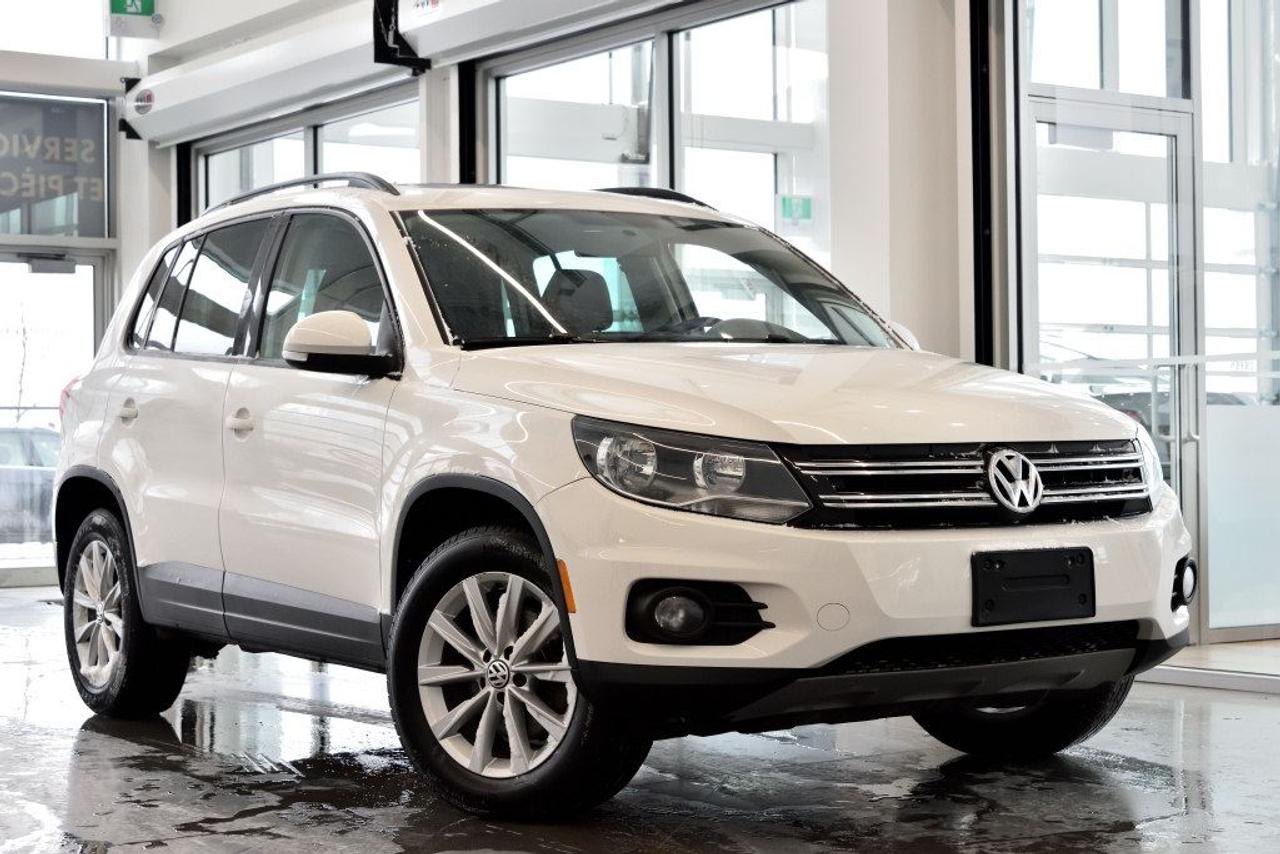 <a href=https://www.vaudreuilvolkswagen.com/occasion/Volkswagen-Tiguan-2014.html>https://www.vaudreuilvolkswagen.com/occasion/Volkswagen-Tiguan-2014.html</a>

Modèle Comfortline équipé de 4motion, toit panoramique, intérieur en similicuir, air climatisé, Bluetooth, bancs chauffants et roues 17 pouces . Un propriétaire.        Possibilité dextension de 2 ans ou 40 000 kms de la garantie dorigine avec la certification supérieure Volkswagen        Aucunes obligations bancaires, aucuns frais cachés        Mise en service : 18 janvier 2014        Bienvenue chez Vaudreuil Volkswagen!