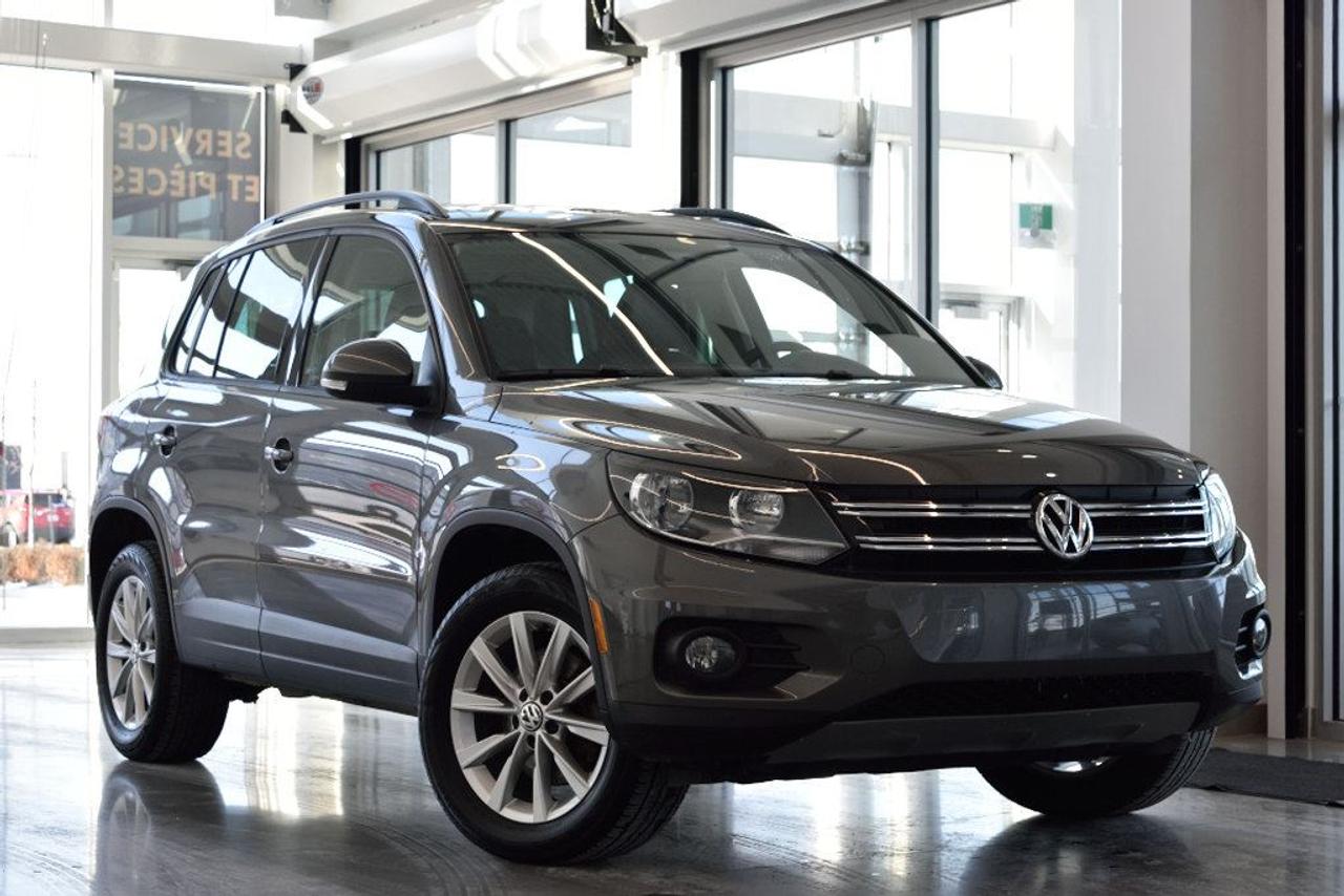 <a href=https://www.vaudreuilvolkswagen.com/occasion/Volkswagen-Tiguan-2014.html>https://www.vaudreuilvolkswagen.com/occasion/Volkswagen-Tiguan-2014.html</a>

Modèle Comfortline , 4motion, toit panoramique, intérieur en similicuir, air climatisée, Bluetooth, bancs chauffants et roues 17 pouces . Un propriétaire client maison, aucuns accidents.    Possibilité dextension de 2 ans ou 40 000 kms de la garantie dorigine avec la certification supérieure Volkswagen    Aucunes obligations bancaires, aucuns frais cachés    Mise en service : 2 décembre 2013    Bienvenue chez Vaudreuil Volkswagen!