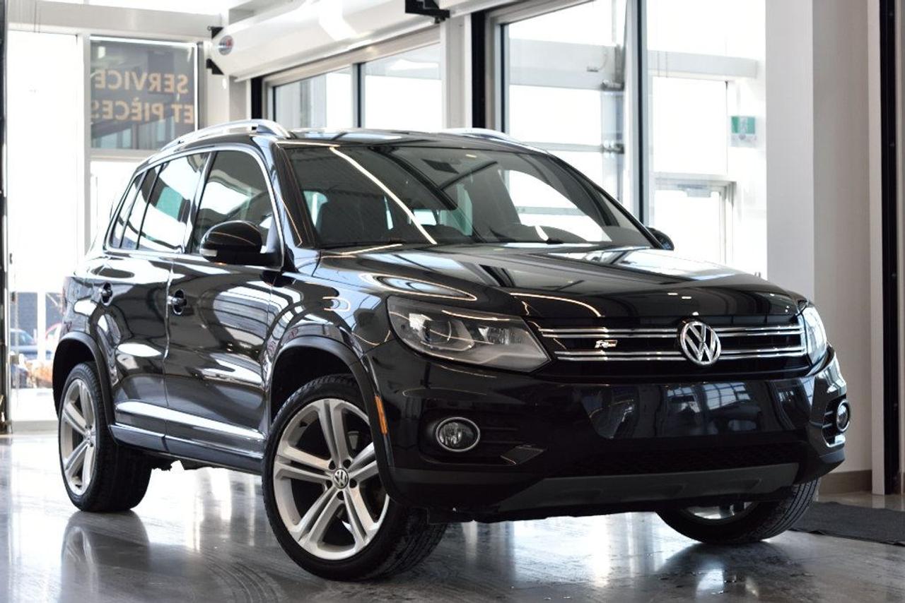 <a href=https://www.vaudreuilvolkswagen.com/occasion/Volkswagen-Tiguan-2016.html>https://www.vaudreuilvolkswagen.com/occasion/Volkswagen-Tiguan-2016.html</a>

Modèle Highline 4motion avec intérieur en cuir brun, ensemble R-Line et technologie. Roues 19, Toit panoramique, navigation/GPS, système de son Fender avec subwoofer, caméra de recul, sièges électriques avec mémoire, lumière automatiques, climatisation deux-zones et essuie-glaces automatiques, volant sport R-line. Jamais accidenté.    Possibilité dextension de 2 ans ou 40 000 kms de la garantie dorigine avec la certification supérieure Volkswagen    Aucunes obligations bancaires, aucuns frais cachés    Mise en service : 29 Avril 2016    Bienvenue chez Vaudreuil Volkswagen!