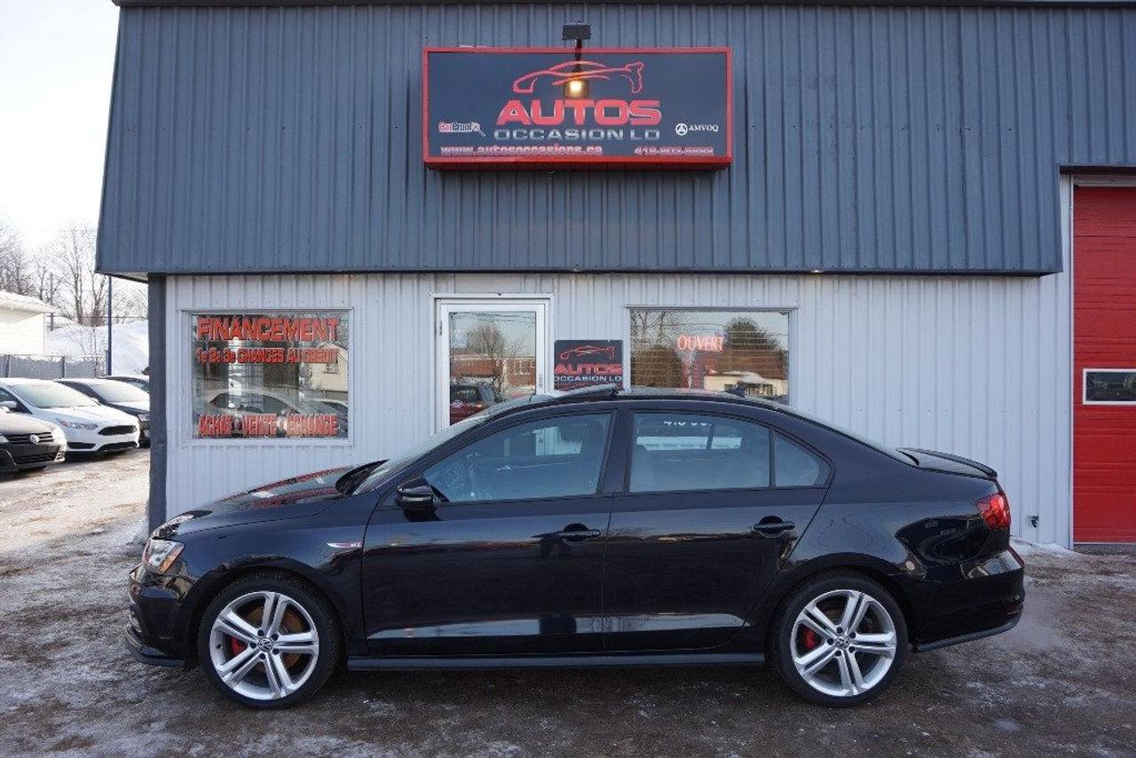 <a href=https://www.autosoccasions.ca/occasion/Volkswagen-Jetta-2017.html>https://www.autosoccasions.ca/occasion/Volkswagen-Jetta-2017.html</a>

VOLKSWAGEN JETTA GLI AUTOBAHN 2017 Édition GLI Autobahn 4cyl 2.0 Litres TURBO TSI 210 Hp ** LE GROS MODÈLE CUIR TOIT OUVRANT GPS NAVI CAMERA AUDIO FENDER -- TRANSMISSION MANUELLE 6 VITESSES -- AVEC SEULEMENT 4226 KM CERTIFIÉ / 1 SEUL PROPRIÉTAIRE : VÉHICULE À LÉTAT NEUF / 4 CYLINDRES 2.0 Litres TSI TURBO Avec 210 Hp PUISSANT ET FIABILITÉ RECONNUE (VÉHICULE ACCIDENTÉ TRÈS LÉGER : PHOTOS DISPONIBLE : RAPPORT CARPROOF INCLUS) COULEUR EXTÉRIEUR NOIR, INTÉRIEUR COMPLET EN CUIR NOIR / SIÈGES CHAUFFANTS-ÉLECTRIQUES. INSPECTION COMPLÈTE INCLUSE -- ÉCHANGE ACCEPTÉ -- FINANCEMENT SUR PLACE À PARTIR 4.99 % -- GARANTIE INCLUS : 1 AN OU 20 000 KM GROUPE MOTOPROPULSEUR -- POSSIBILITÉ DE GARANTIE PROLONGÉE À PRIX IMBATTABLE Avec Caa et Groupe Ppp jusquà 5 ans ou 100 000 km !!! ÉQUIPEMENT COMPLET GLI Autobahn : AIR CLIMATISÉ BI-ZONES - RÉGULATEUR VITESSES - AILERON - SYSTÈME DE GPS ET NAVIGATION - TOIT OUVRANT ÉLECTRIQUE - PHARES ANTI-BROUILLARDS - LUMIÈRE AU LED - CAMERA DE RECULE AVEC SENSOR - JANTES 18 POUCES / PNEUS DÉTÉ COMME NEUF - DÉMARRAGE SANS CLÉ - GROUPES ÉLECTRIQUES COMPLETS - ORDINATEUR DE BORD - SYSTÈME AUDIO FENDER - LECTEUR CD-Mp3 - CONTRÔLE AUDIO AU VOLANT - BLUETOOTH/TÉLÉPHONE - VOLANT AJUSTABLE === POUR PLUS DINFORMATION DEMANDER (DAVID.LAMONTAGNE) 418-903-5882 // 418-931-4036 Cell === FINANCEMENT FACILE SUR PLACE 4.99 % NOUS SOMMES OUVERTS 6 JOURS : 2430 BOUL GUILLAUME-COUTURE, LÉVIS G6W-2R5 : AU PLAISIR DE VOUS SERVIR WWW.AUTOSOCCASIONS.CA