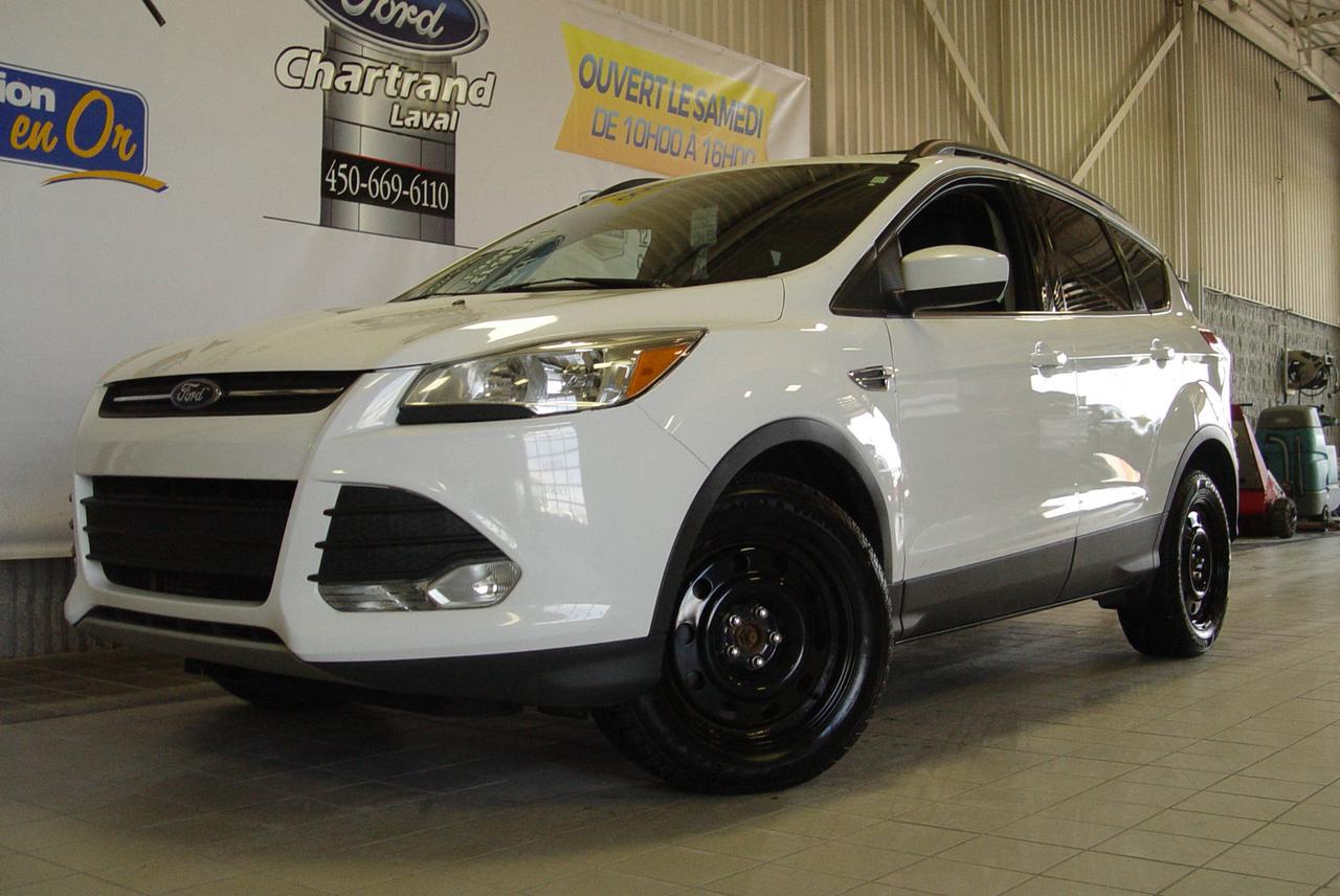<a href=https://www.chartrandford.com/occasion/Ford-Escape-2014.html>https://www.chartrandford.com/occasion/Ford-Escape-2014.html</a>

Le Ford Escape est le véhicule utilitaire le plus intelligent, doté des points forts les plus appréciés des clients d aujourd hui : l économie de carburant, la polyvalence et les technologies qui rendent la propriété et la conduite du véhicule plus facile et plus agréable.  

le Ford Escape demeurera l un des VUS compacts le plus populaire au Canada.

Disponible dès maintenant chez Chartrand Ford à Laval à deux pas de Montréal. Les meilleures transactions sont chez Chartrand Ford. Le financement est facile et rapide. Notre équipe dexpert saura répondre à toutes vos questions au 450.669.6110