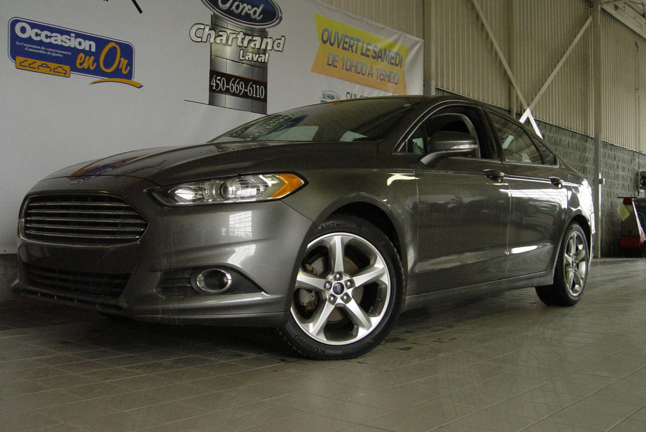 <a href=https://www.chartrandford.com/occasion/Ford-Fusion-2014.html>https://www.chartrandford.com/occasion/Ford-Fusion-2014.html</a>

Cette Ford Fusion SE 2014 est absolument impécable.  

La Fusion est connue pour son style audacieux, son excellente tenue de route et sa sécurité exceptionnelle. Ajoutez-y une superbe économie de carburant, des technologies intelligentes et des cotes maximales de qualité et de satisfaction.  Ainsi, on comprend facilement pourquoi la Fusion est privilégiée par les acheteurs.

Disponible dès maintenant chez Chartrand Ford à Laval à deux pas de Montréal. Les meilleures transactions sont chez Chartrand Ford. Le financement est facile et rapide. Notre équipe dexpert saura répondre à toutes vos questions au 450.669.6110