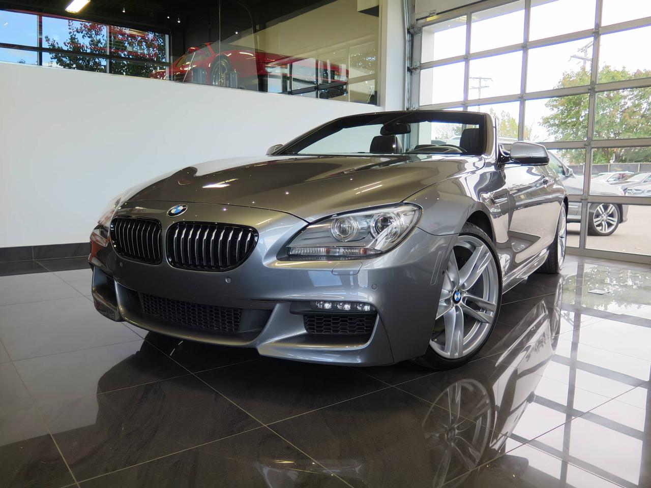 <a href=https://www.lombardisignature.com/occasion/BMW-6_Series-2014.html>https://www.lombardisignature.com/occasion/BMW-6_Series-2014.html</a>

M PERFORMANCE, XDRIVE, AWD, 8 CYLINDRES, 4.4 L, 445  HP, AUTOMATIQUE  8 VITESSES.

BMW 650I cabriolet, extérieur gris avec intérieur de cuir noir Dakota. M PERFORMANCE package, Sièges électriques mémoires/chauffants, Jantes en alliage 19 po, Système de Navigation GPS, Bluetooth, palonniers de changement de vitesses, volant chauffant et gainé de cuir, caméra de recul, 360°camera avec vue périphérique, afficheur tête haute, Phares Adaptatif/Bi Xénon, sélection mode de conduite, Entrée/démarrage sans clef  et plus bien plus encore!

Garantie complète manufacturier jusquau 23 Avril 2018 / 80 000 km.

-Rapport CARPROOF disponible.
-Véhicule entièrement INSPECTÉ et reconditionné.
- 1ère, 2e chance au crédit.
-Nous prenons vos ÉCHANGES, nous lachèterons au meilleur prix.
- Livraison en moins de 24h. 
- Nous livrons partout au Canada.
-Avec financement.
- Ouvert 6 jours/5 soirs,  Lundi-Mercredi 10:00-18:00, Jeudi-Vendredi 10:00-20:00, Samedi 10:00-14:00. 

Réservez un essai routier dès aujourdhui.
Visitez www.lombardisignature.com ou venez nous rencontrer sur place ou 7200 boul. Langelier, Montréal, QC, H1S 2X6. Tél: (1) 514 255-2222 OU SANS FRAIS 1 855 781-7822.
Le prix ne comprend pas les taxes ou les frais de documentation détaillant.