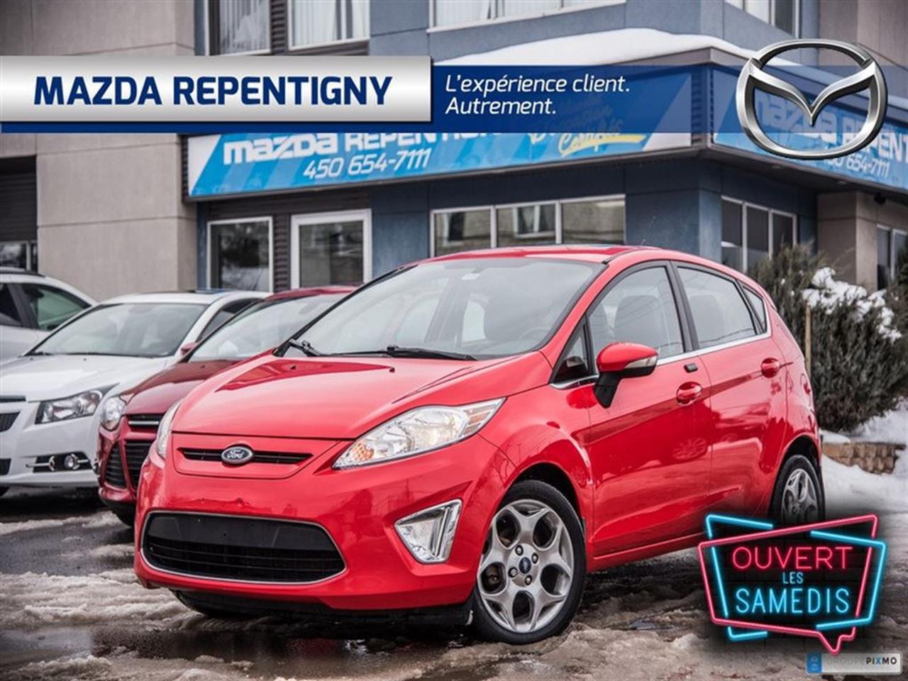 <a href=https://www.mazdarepentigny.com/occasion/Ford-Fiesta-2013.html>https://www.mazdarepentigny.com/occasion/Ford-Fiesta-2013.html</a>

Bluetooth+sièges chauffants+cuir+toit ouvrant+régulateur de vitesse+air climatisé+phares automatiques+essuie glace détecteur de pluie+mags et beaucoup plus a qui la chance !!!    MAINTENANT OUVERT LE SAMEDI !!! Mazda Repentigny: Votre concessionnaire de choix pour un véhicule neuf ou doccasion. Financement à partir de 0% pour un véhicule doccasion certifié. Financement 1-2-3e chance au crédit disponible. Meilleurs taux de lindustrie.     Venez voir pourquoi nous sommes votre référence automobile.     Faites un essai routier dès aujourdhui de votre prochain véhicule acheté chez Mazda Repentigny