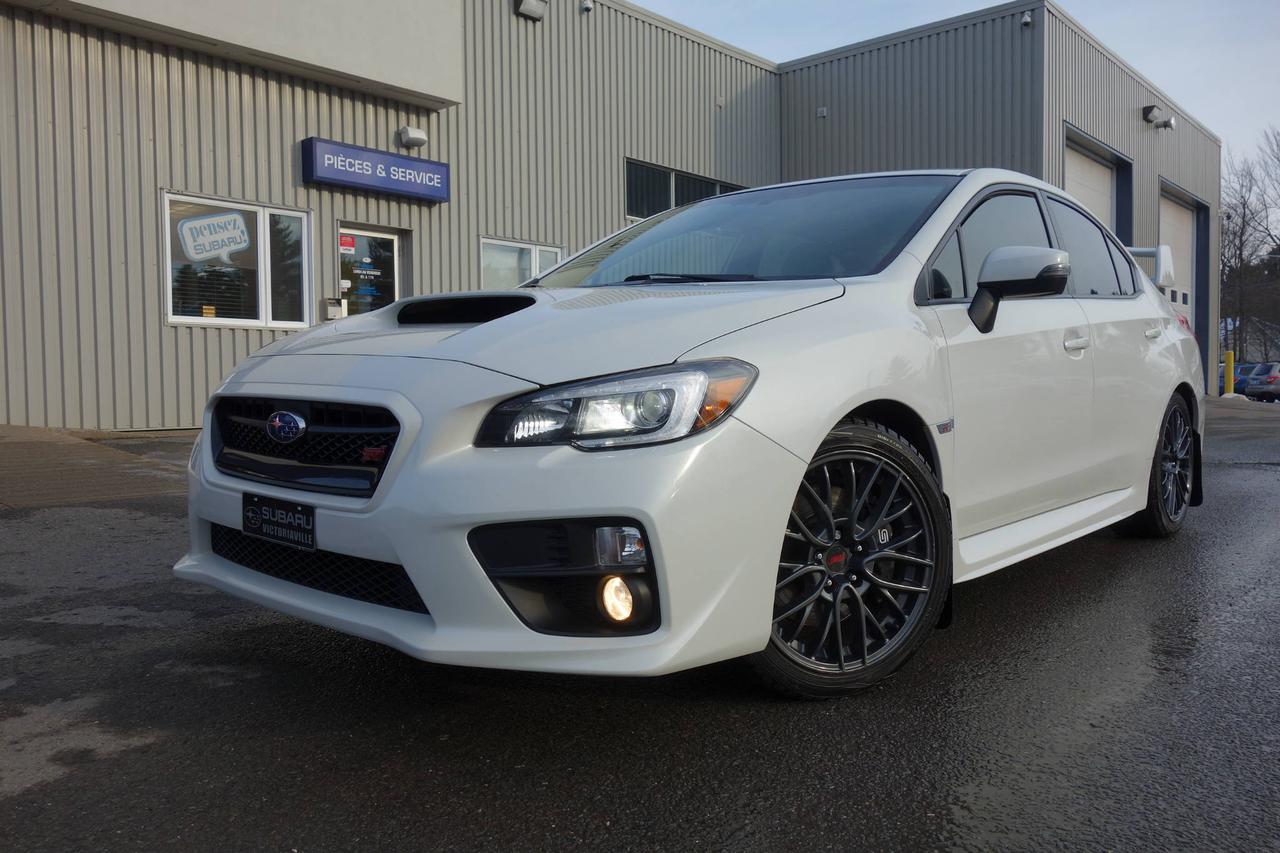 <a href=https://www.subaruvictoriaville.ca/occasion/Subaru-WRX_STI-2015.html>https://www.subaruvictoriaville.ca/occasion/Subaru-WRX_STI-2015.html</a>

** VÉHICULE CERTIFIÉ SUBARU ** incluant Garantie Limitée, Privilège déchange, Assistance Routière, Rapport Carproof et Inspection en 152 points approuvé par des techniciens Subaru.    Caractéristiques clés ; Moteur à haut rendement BOXER SUBARU de 2,5 litres, avec turbocompresseur haute pression, refroidisseur dair et système SI-DRIVE, Transmission manuelle à 6 rapports ou, en option, boîte automatique Sport LineartronicMC avec système SI-DRIVE et palettes de vitesse, Système de détection de véhicules en approche et de surveillance dangle mort Subaru (SRVD), Toit ouvrant vitré électrique, entrebâillant et coulissant, Feux de croisement à DEL à allumage/extinction automatique et feux de route halogènes à réflecteurs multiples, Antibrouillards halogènes à réflecteurs multiples, Siège conducteur à 8 réglages électriques, Clé intelligente avec démarrage par bouton-poussoir, Système de neuf enceintes Harman Kardon® haut de gamme (incluant caisson de graves) et amplificateur de 440 watts, Différentiel central multimode sur demande (DCCD), Grand déflecteur arrière à profil surélevé, Feux de croisement à DEL à allumage/extinction automatique et feux de route halogènes à réflecteurs multiples, Système de détection de véhicules en approche et de surveillance dangle mort Subaru (SRVD), Toit ouvrant vitré électrique, entrebâillant et coulissant, Siège conducteur à 8 réglages électriques, Jantes BBS en alliage daluminium forgé de 18 pouces, Assise des sièges en cuir de première qualité, Système infodivertissement et de navigation à écran tactile multigeste haute résolution de 7 po, radio SiriusXMMC/Traffic (abonnement requis), et applications et services STARLINKMC, Système de neuf enceintes Harman Kardon® haut de gamme (incluant caisson de graves) et amplificateur de 440 watts. Garantie supplémentaire et Rapport CarProof disponible pour vous !     ** BALANCE DE GARANTIE DE SUBARU CANADA VALIDE JUSQUEN MAI 2019 OU 100 000 KM ** WWW.SUBARUVICTORIAVILLE.CA    English service is also available. You are welcome to contact us by email or call.