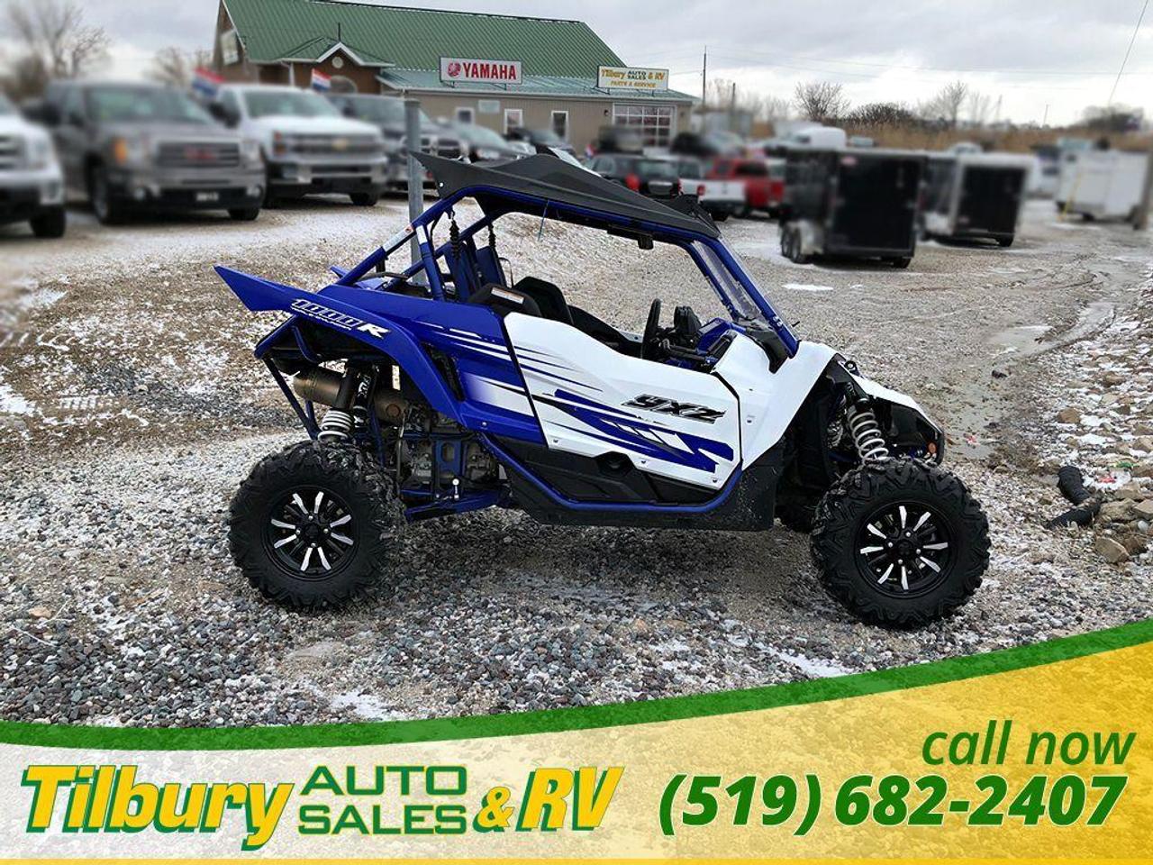 <p><strong style=font-size: medium;><span style=font-family: Verdana,sans-serif; mso-bidi-font-family: Arial; background: white;>Call us at 519-682-2407 or visit our lot at 20600 HWY #42, Tilbury, Ontario. Canada.&nbsp;<br />+PREP AND FREIGHT CHARGES.&nbsp;<br /><br />This unit was previously a DEMO. Purchased and used for a couple of months. It is now USED and ready to go! Fully customized as well. Has a lightbar, upgraded radio/speaker system and windshield. Perfect for ripping through the county!</span></strong></p>
<p class=MsoNormal><span style=font-size: medium;><strong>Unmatched Side-by-Side Performance:</strong>&nbsp;</span><span style=font-size: medium;>The all-new YXZ1000R doesn&rsquo;t just reset the bar for sport side-by-sides, it is proof that Yamaha is the leader in powersports performance. Featuring a new 998cc inline triple engine mated to a 5-speed sequential shift gearbox with On-Command&reg; 4WD, massive FOX Racing Shox&reg; suspension front and rear, and styling the competition can&rsquo;t touch, the new YXZ1000R is in a class by itself&mdash;the only true pure sport side-by-side ever developed.</span></p>
<p class=MsoNormal><span style=font-size: medium;><strong>Stunning, Industry-first Three-Cylinder Engine:</strong>&nbsp;</span><span style=font-size: medium;>Prepare yourself for the industry&rsquo;s first 998cc inline-three cylinder sport side-by-side engine. Featuring a compact DOHC twelve-valve cylinder head, an aggressive 11.3:1 compression ratio and high-tech dry-sump lubrication, the YXZ1000R engine offers jaw-dropping power, fantastic midrange torque and a thrilling 10,500 rpm redline. With lightweight 80mm forged aluminum pistons and a counterbalancer, the motor is exceptionally smooth-running, too. Built for the pure sport side-by-side enthusiast, there&rsquo;s nothing else like it.</span></p>
<p class=MsoNormal><span style=font-size: medium;><strong>Industry-first 5-Speed Sequential Shift Transmission with On-Command 4WD:</strong>&nbsp;</span><span style=font-size: medium;>The YXZ1000R establishes a direct connection with driver via an all-new sequential 5-speed manual transmission with reverse that permits rapid and smooth shifting, ideally matched to the potent three-cylinder engine. A beefy hydraulically-actuated clutch system is operated by an automotive-style foot pedal for light, consistent feel and an entirely new sports side-by-side experience. Yamaha&rsquo;s proven On-Command 4WD system with full Diff Lock is ready to tackle challenging terrain, and the entire driveline is built to provide unmatched durability.</span></p>
<p class=MsoNormal><span style=font-size: medium;><strong>Terrain Conquering, Fully-adjustable FOX Podium RC2 Shocks&reg;:</strong>&nbsp;</span><span style=font-size: medium;>Jutting defiantly through the front hood and defining the rear of the vehicle, the YXZ1000R&rsquo;s huge piggyback FOX&reg; 2.5 Podium RC2 Shocks&reg; bring visual impact with unmatched performance. All four corners are fully adjustable&mdash;spring preload, rebound and both high- and low-speed compression damping&mdash;with a huge 16.2 inches of front travel and 17.0 inches at the rear, with integrated Bottom-Out technology as well as front and rear sway bars. Result: The ultimate in ride quality, tuneability and handling. Whether you&rsquo;re riding in dunes or dirt, the YXZ1000R suspension will handle the toughest terrain.</span></p>
<p class=MsoNormal><span style=font-size: medium;><strong>Ergonomics Built for Performance:</strong>&nbsp;</span><span style=font-size: medium;>The YXZ1000R cab features plush cut-and-sew high-back seats with extra lateral support and outside shoulder bolsters, and the cockpit is built to provide a balanced combination of secure confidence with comfort. The floorboards are shaped to provide generous legroom while still giving a planted feel during aggressive driving, too. The driver&rsquo;s seat is adjustable across 3.5 inches, and the steering wheel is tilt adjustable 5.8 inches to ensure a perfect fit.</span></p>
<p class=MsoNormal><br /><strong style=font-size: medium;><span style=font-family: Verdana,sans-serif; mso-bidi-font-family: Arial; background: white;>Call us at 519-682-2407 or visit our lot at 20600 HWY #42, Tilbury, Ontario. Canada.&nbsp;</span></strong></p>
<p class=MsoNormal><span style=font-size: 7.5pt; line-height: 115%; font-family: Arial,sans-serif; background: white; font-weight: normal;>While every reasonable effort is m</span><strong><span style=font-size: 7.5pt; line-height: 115%; font-family: Arial,sans-serif; background: white; font-weight: normal;>ade to ensure the accuracy of this data, we are not responsible for any errors or omissions contained on these pages. Please verify any information in question with a dealership sales representative. Serving, Windsor, Essex, Tilbury, Chatham, Blenheim, Rodney, St. Marys, St. Thomas, Leamington, Harrow, Amherstburg, Kingsville, Wheatley, Belle River, Lakeshore, Wallaceburg, Sarnia,London, Lambton, Lambton County, Lambeth, Essex County, Middlesex, Middlesex County, Rodney, Dresden, Thamesville, Lasalle, Watford, Ailsa Craig, Glencoe, Alvinston, Parkhill, Strathroy, Mt.Brydges, West Lorne, Dutton, Aylmer * Prices in Ontario, include OMVIC/AMVIC fee (where applicable), dealer administration and other retailer charges and exclude taxes, license, insurance, plus HST* * While every reasonable effort is made to ensure the accuracy of this information, we are not responsible for any errors or omissions contained on these pages. Please verify any information in question with Tilbury Auto Sales & RV. .</span></strong></p>
<p>&nbsp;</p>
