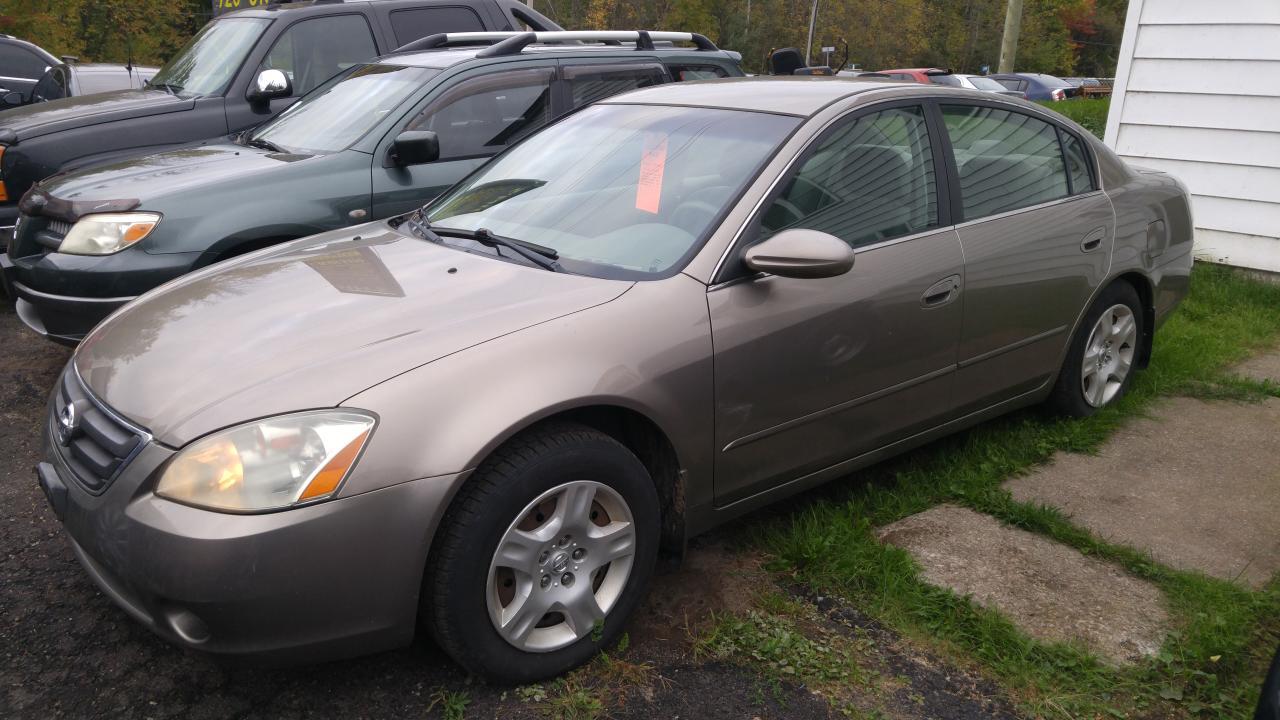 2004 nissan Altima 4 door automatic transmission ice cold air pw pl cruise tilt pm 200396kms runs great certified $ 3999