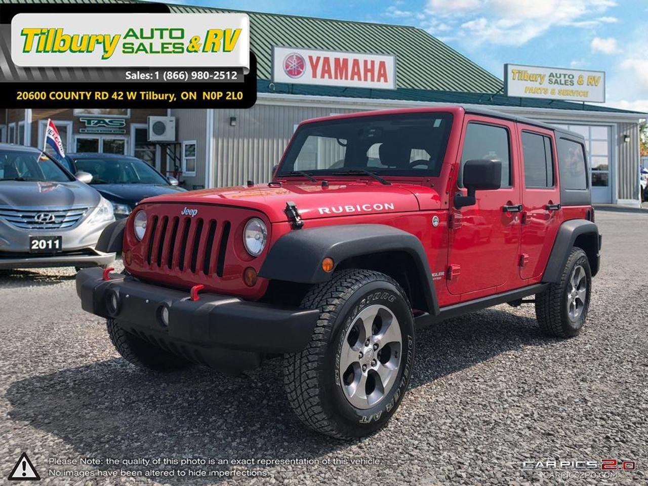 <p class=MsoNormal><span style=background: white; font-size: medium;><span style=font-family: Verdana, sans-serif;><strong>Call us at 519-682-2407 or visit our lot at 20600 HWY #42, Tilbury, Ontario. Canada. + pdi and prep charges<br /></strong></span></span></p>
<p class=MsoNormal><span style=font-size: medium;><span style=font-family: Verdana, sans-serif;>The 2011 Jeep Wrangler is pretty much unstoppable in off-road situations, especially in Rubicon guise, thanks to its specialized hardware. The Wrangler is also surprisingly fun to drive around the city. Steering wheel controls. Large touch screen display.&nbsp;</span></span></p>
<p class=MsoNormal><span style=font-size: medium;><span style=font-family: Verdana, sans-serif;>3.8-liter V6 that produces 202 horsepower and 237 pound-feet of torque. 4 speed automatic. EPA-estimated fuel economy is 15 mpg city/19 mpg highway and 17 mpg combined.&nbsp;</span></span></p>
<p class=MsoNormal><span style=font-size: medium;><span style=font-family: Verdana, sans-serif;>17-inch alloy wheels, special tires, off-road suspension, an electrically controlled antiroll bar that can be disconnected for more wheel articulation while off-road, electronically locking front and rear differentials, a stronger front axle, a special low-range transfer case and rock rails.</span></span></p>
<p class=MsoNormal><span style=font-size: medium;><span style=font-family: Verdana, sans-serif;>The Rubicon also features equipment unrelated to its hard-core off-road abilities, including acoustic insulation under the hood, automatic headlamps, air-conditioning, leather-wrapped steering wheel and satellite radio. Rubicon models have a specialized transfer case that provides extra-low gearing for enhanced off-road ability. The interior is great, this is still a vehicle meant to drive through dust, dirt and muck and then be easily cleaned afterward.&nbsp;</span></span></p>
<p class=MsoNormal><span style=font-family: Verdana,sans-serif; color: black; background: white;><strong style=font-family: Verdana, sans-serif;><span style=font-size: medium;>Call us at 519-682-2407 or visit our lot at 20600 HWY #42, Tilbury, Ontario. Canada. + pdi and prep charges</span><br /></strong><br /> </span><strong><span style=font-size: 7.5pt; line-height: 115%; font-family: Arial,sans-serif; color: black; background: white; font-weight: normal;>While every reasonable effort is made to ensure the accuracy of this data, we are not responsible for any errors or omissions contained on these pages. Please verify any information in question with a dealership sales representative. Serving, Windsor, Essex, Tilbury, Chatham, Blenheim, Rodney, St. Marys, St. Thomas, Leamington, Harrow, Amherstburg, Kingsville, Wheatley, Belle River, Lakeshore, Wallaceburg, Sarnia,London, Lambton, Lambton County, Lambeth, Essex County, Middlesex, Middlesex County, Rodney, Dresden, Thamesville, Lasalle, Watford, Ailsa Craig, Glencoe, Alvinston, Parkhill, Strathroy, Mt.Brydges, West Lorne, Dutton, Aylmer * Prices in Ontario, include OMVIC/AMVIC fee (where applicable), dealer administration and other retailer charges and exclude taxes, license, insurance, plus HST* * While every reasonable effort is made to ensure the accuracy of this information, we are not responsible for any errors or omissions contained on these pages. Please verify any information in question with Tilbury Auto Sales & RV</span></strong></p>