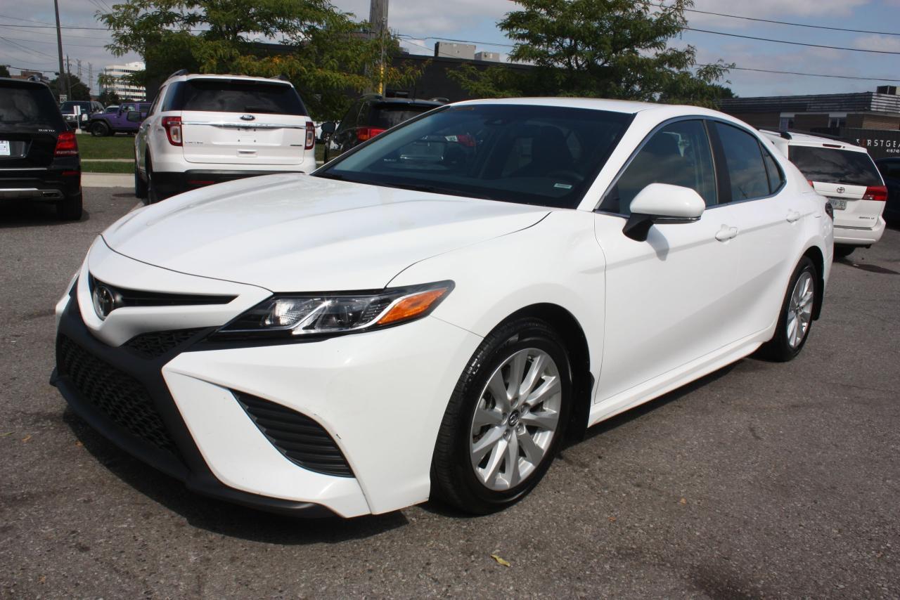 THIS 2018 TOYOTA CAMRY WHITE, COMES WITH FULL POWER GROUP OPTIONS. BACKUP CAMERA, BLUETOOTH, HEATED SEATS, AND COMES WITH A CLEAN CANADIAN CAR PROOF AND MUCH MUCH MORE, THIS VEHICLE COMES FULLY CERTIFIED, E-TEST AND ADMIN FEES ALL INCLUDED IN THE PRICE, FOR MORE INFO PLEASE CONTACT US AT 1855-350-1313 AT AA Canada INC. all of our vehicles come with a Safety Standard Certificate, Emission test plus HST. CARPROOF will be provided at the dealership ALL TRADE INS WELCOME. We also provide warranty packages and financing rates starting at 4.5% all credits types GOOD OR BAD CREDIT! Interested? We are here to serve you, call us at Toll free 1-855-350-1313 or 647-350-1313 email us at aacanadainc@gmail.com or visit us online at www.aacanadainc.com
