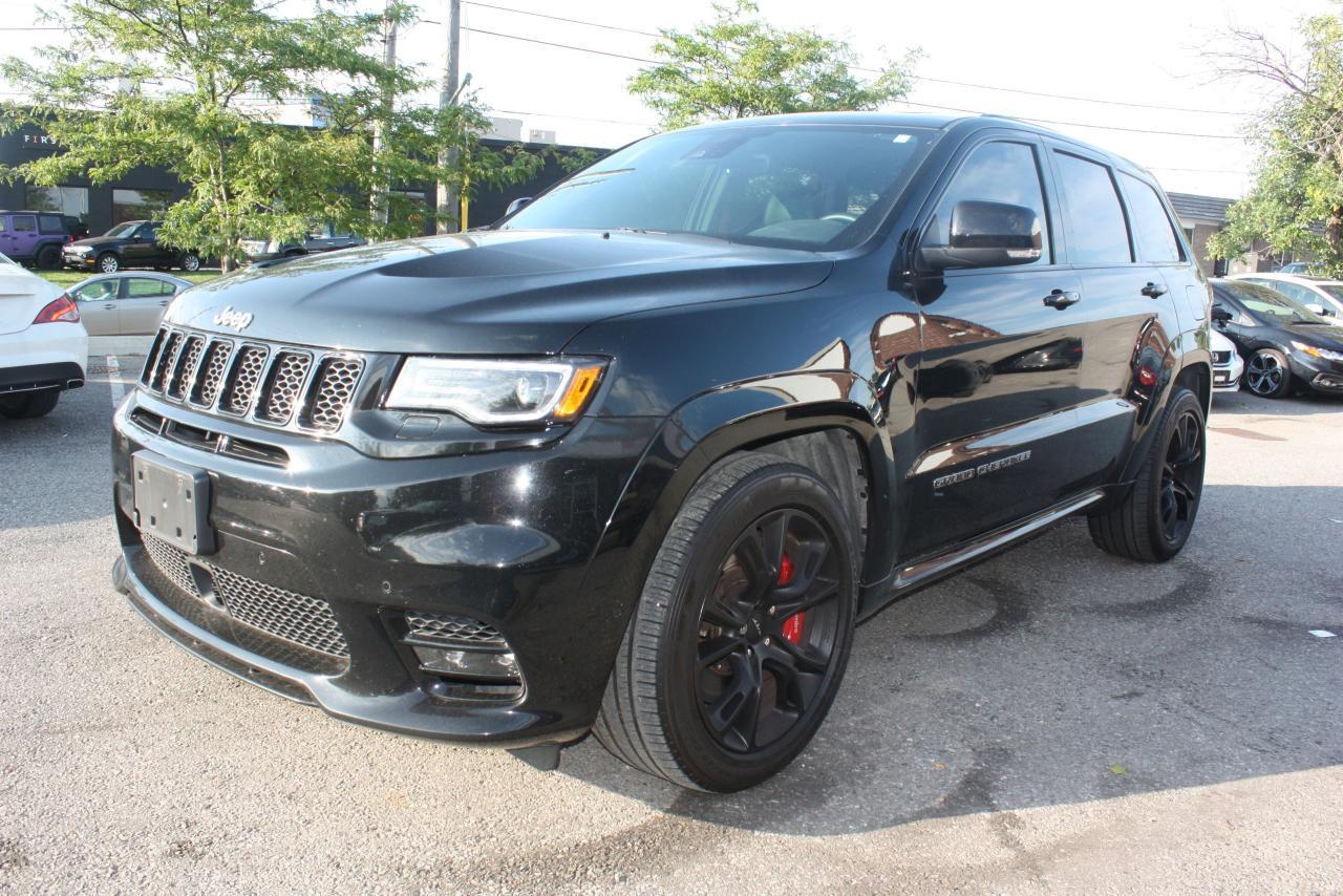 THIS BEAUTIFUL 2017 BLACK JEEP GRAND CHEROKEE SRT COMES FULLY EQUIPPED WITH FACTORY - LUXURY, ENTERTAINMENT AND PERFORMANCE PACKAGE. FROM ITS 6.4L HEMI PERFORMANCE ENGINE, TO THE STOPPING POWER OF ITS BREMBO FULL SIZE BREAKS, THIS VEHCLE WILL ACCELERATE TO 100 IN LESS THAN 4.4 SECONDS WITH ITS LAUNCH CONTROL AND STOP IN HALF! ADAPTIVE CRUISE CONTROL, PANORAMIC SUNROOF, NAVIGATION, REAR ENTERTAINMENT PACKAGE AND MUCH MUCH MORE! HIS VEHICLE COMES FULLY CERTIFIED, E-TEST AND ADMIN FEES ALL INCLUDED IN THE PRICE, FOR MORE INFO PLEASE CONTACT US AT 1855-350-1313 AT AA Canada INC. all of our vehicles come with a Safety Standard Certificate, Emission test plus HST. CARPROOF will be provided at the dealership ALL TRADE INS WELCOME. We also provide warranty packages and financing rates starting at 4.5% all credits types GOOD OR BAD CREDIT! Interested? We are here to serve you, call us at Toll free 1-855-350-1313 or 647-350-1313 email us at aacanadainc@gmail.com or visit us online at www.aacanadainc.com