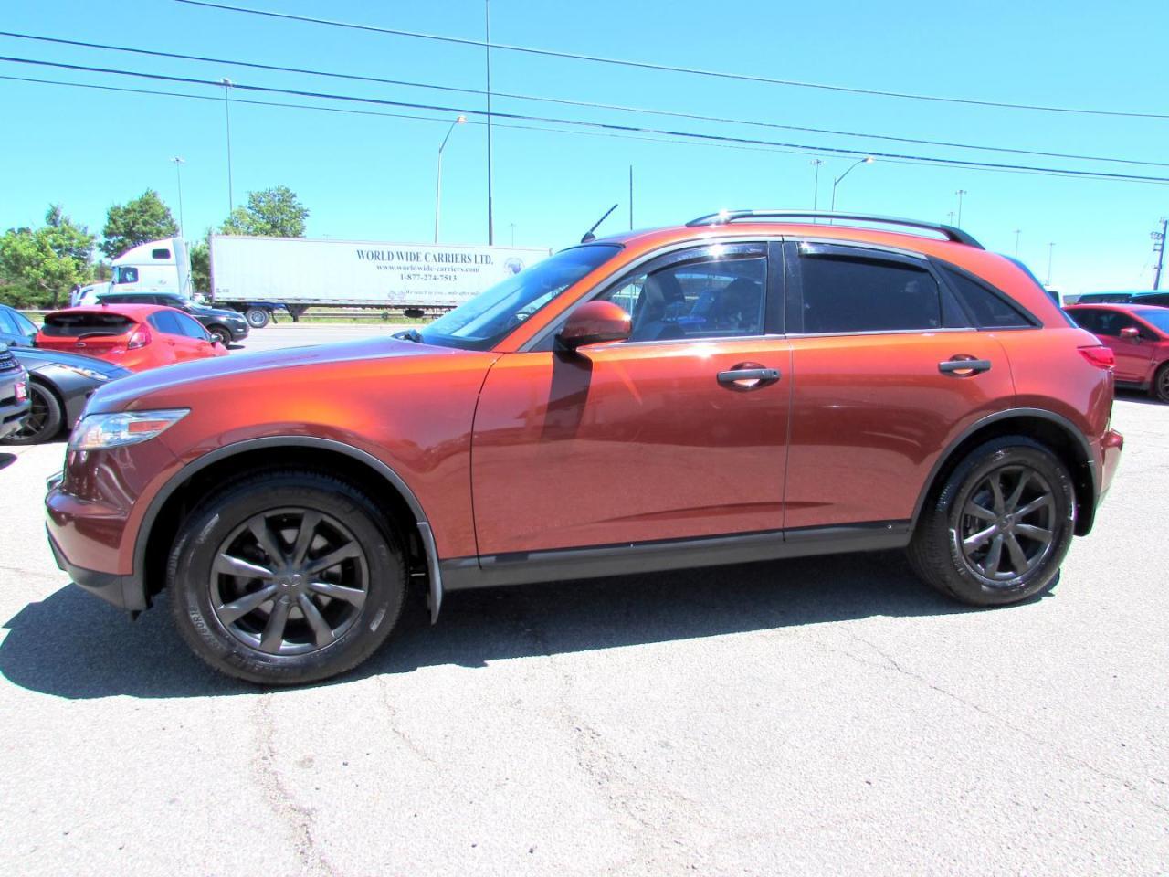 *ACCIDENT FREE*LOCAL VEHICLE*Infiniti FX35, AWD With Navigation System, DVD Entertainment PKG, Surround Camera, Cooper on Black Leather Int. Fully Loaded with: Power Windows, Locks, Mirrors, CD, AC, Keyless Entry, Alarm Impact Sensor, DVD Entertainment Package, Cruise Control, Navigation System, Surround Camera, Lane Departure Warning, Sunroof, Bluetooth, Auto Dimming Mirrors, Heated Memory Leather Seats, Alloys, ALL THE POWER OPTIONS!! Vehicle Comes With: Safety Certification, 2 Year Power Train (Engine/ Transmission) Seals & Gaskets Warranty, and Car Proof Report ALL INCLUDED!! At no extra cost to you!! Auto Moto Of Ontario @ 583 Main St E. , Milton, L9T3J2 ON. Please call for further details. 905-281-2255 ALL TRADE INS ARE WELCOMED!
