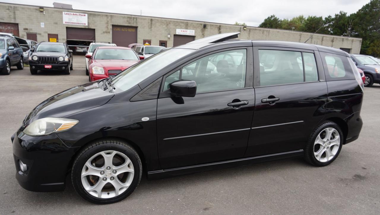 *ACCIDENT FREE*LOCAL ONTARIO CAR* Very Clean Mazda5 Grand Touring 6 Passenger With Automatic Transmission, Black on Black Int. Loaded with: Sunroof, Power Windows, Power Locks, Mirrors, CD, AC, Keyless, Alloys, ALL THE POWER OPTIONS!! Vehicle Comes With: Safety Certification, 2 Year Power Train (Engine/ Transmission) Seals & Gaskets Warranty, and Car Proof Report ALL INCLUDED!! At no extra cost to you!! Auto Moto Of Ontario @ 583 Main St E. , Milton, L9T3J2 ON. Please call for further details. 905-281-2255 ALL TRADE INS ARE WELCOMED!