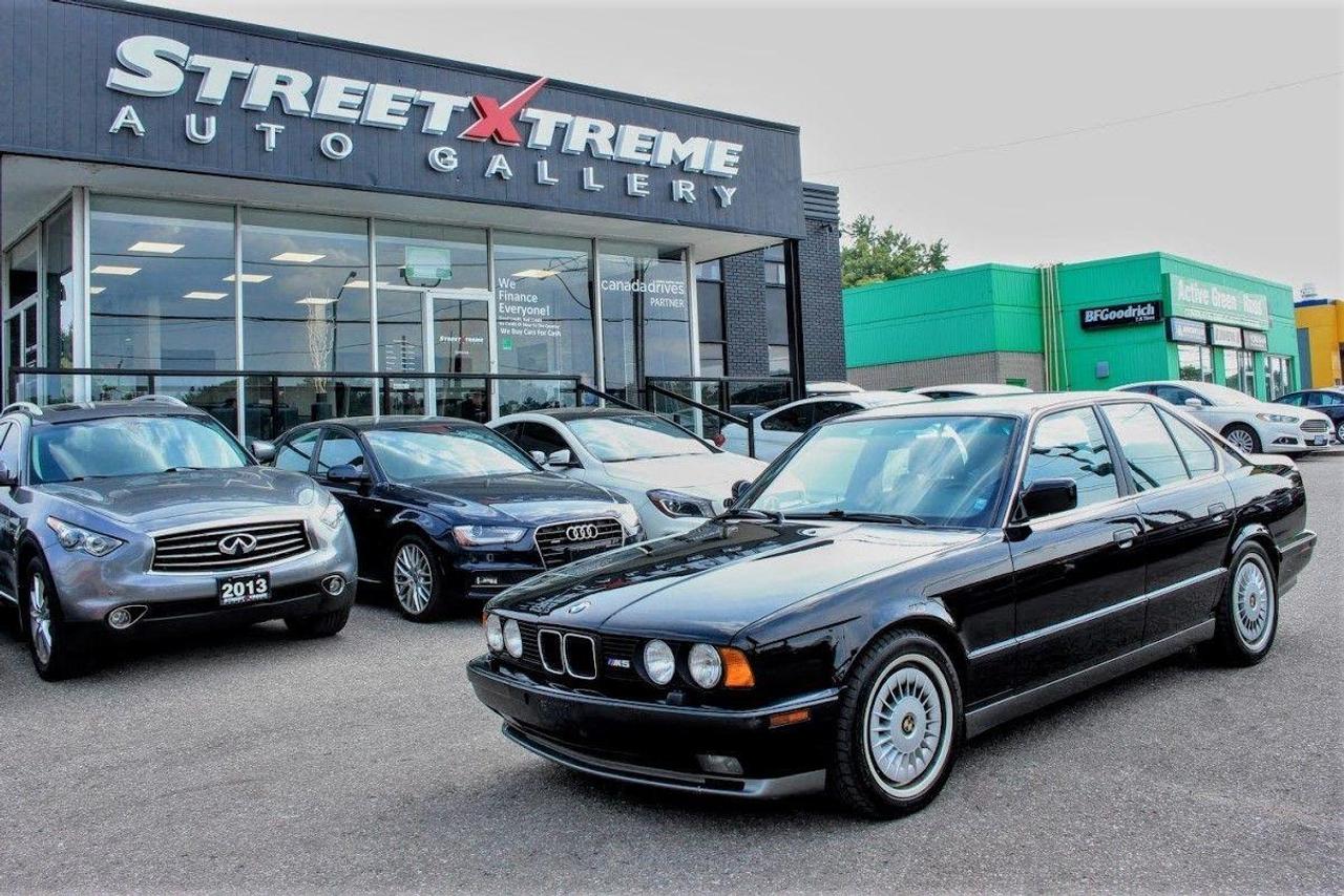 <p>&nbsp;</p>
<p><span style=font-size: small;>Take the engine, for starters&mdash;a crown jewel of a powerplant. The BMW S38 in&shy; line six began life as the 24-valve special powering the marvelous but star-crossed 1978 M1 supercar. More than just a twin&shy;cam-head conversion on the true-blue BMW 3.5, it included a juggling of bore and stroke dimensions (increased and decreased, respectively) for a more oversquare configuration. With mechan&shy;ical fuel injection (and of course, no cata&shy;lytic convener), it produced 266 hp. This one of a kind M5 also includes leather interior, clean CarProof Non-Accident Vehicle, power seats, rear window defroster, sunroof, and much more! You will not find another M5 of this year in such pristine condition</span></p>
<p>&nbsp;</p>
<p><span style=font-size: small;>**A WHEEL BALANCE, ALIGNMENT, & OIL CHANGE IS INCLUDED IN EVERY CERTIFIED VEHICLE**</span></p>
<p><span style=font-size: small;>&nbsp;</span></p>
<p><span style=font-size: small;>WARRANTY COVERAGE can be added at an additional cost. StreetXtreme offers a wide range of coverages to suit all your needs. We are also an authorized service centre for all our warranty companies for your convenience. A true one-stop-shop!</span></p>
<p><span style=font-size: small;>&nbsp;</span></p>
<p><span style=font-size: small;>This vehicle will come SAFETY CERTIFIED & FULLY DETAILED</span></p>
<p><span style=font-size: small;>HST + LICENSING EXTRA</span></p>
<p><span style=font-size: small;>We are an OMVIC & UCDA member so buy with confidence and more importantly... a PEACE OF MIND.</span></p>
<p><span style=font-size: small;>&nbsp;</span></p>
<p><span style=font-size: small;>StreetXtreme strives to purchase our vehicles at the lowest cost so we can retail it for the lowest price. We spend quality time doing our research to make sure our prices are competitive and for this reason, our prices are HAGGLE FREE. Thank you for understanding.</span></p>
<p><span style=font-size: small;>&nbsp;</span></p>
<p><span style=font-size: small;>CALL NOW at (905) 554-8628 - Press #1 for Sales Department OR you can also call:</span></p>
<p><span style=font-size: small;>Kevin @ (647) 927-8780</span></p>
<p><span style=font-size: small;>Tommy @ (416) 720-7721</span></p>
<p><span style=font-size: small;>Nathan @ (647) 575-8892</span></p>
<p><span style=font-size: small;>&nbsp;</span></p>
<p><span style=font-size: small;>To view our full inventory list, please visit: https://www.streetxtreme.ca/vehicles/</span></p>
<p><span style=font-size: small;>&nbsp;</span></p>
<p><span style=font-size: small;>StreetXtreme Auto Gallery</span></p>
<p><span style=font-size: small;>5829 Hwy 7 East</span></p>
<p><span style=font-size: small;>Markham, Ontario</span></p>
<p><span style=font-size: small;>L3P 1A5</span></p>
<p><span style=font-size: small;>(905) 554-8628 Ext. 1</span></p>
<p><span style=font-size: small;>&nbsp;</span></p>
<p><span style=font-size: small;>StreetXtreme Street Extreme StreetExtreme Street Xtreme</span></p>