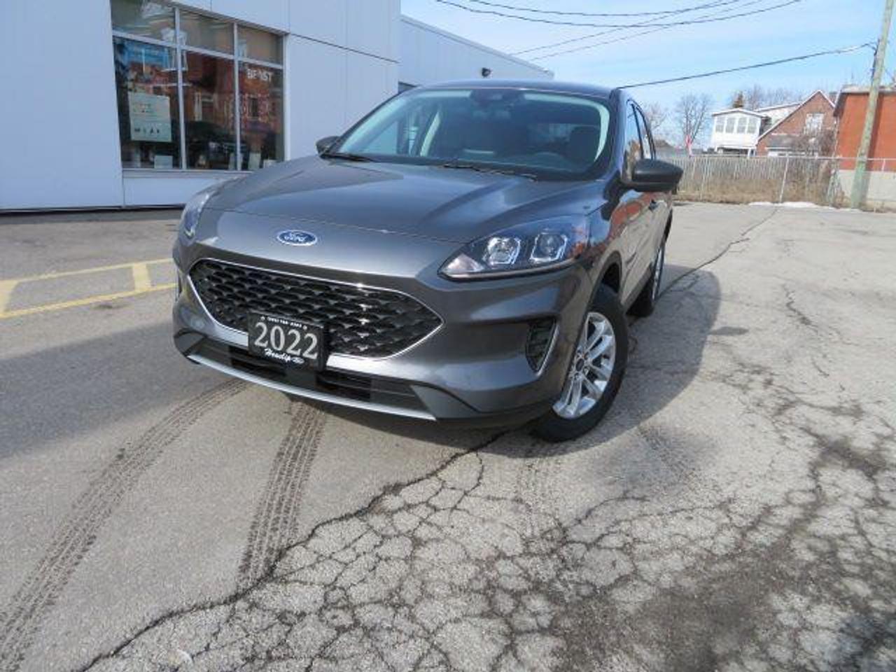 <p>The 2022 Ford Escape SE, a sleek and stylish SUV, is now available at Heaslip Ford. This new vehicle boasts a Carbonized Grey exterior with a DARK EARTH GREY CLOTH interior. With its 1.5L EcoBoost engine and Automatic transmission, the Escape SE is built for both comfort and performance. It offers a smooth ride, making it perfect for navigating city streets or taking on a weekend adventure.</p><p>The Escape SE is packed with features that enhance your driving experience, including advanced safety technology. The Ford Co-Pilot360 suite includes Automatic Emergency Braking (AEB), Cross-Traffic Alert, and a Rearview Back-Up Camera. Enjoy the convenience of Bluetooth wireless phone connectivity, heated front seats, and a heated steering wheel, all designed to keep you comfortable and connected. With a spacious interior and a host of cutting-edge features, the Ford Escape SE is ready to take you where you need to go in style and comfort.</p><p>Here are five sizzling features of the Ford Escape SE:</p><ol><li><strong>Ford Co-Pilot360:</strong> Advanced safety technology includes Automatic Emergency Braking, Cross-Traffic Alert, and a Rearview Back-Up Camera to help keep you safe on the road.</li><li><strong>Heated Front Seats & Steering Wheel:</strong> Stay warm and cozy even on chilly days with heated front seats and a heated steering wheel.</li><li><strong>1.5L EcoBoost Engine:</strong> Experience powerful performance with the responsive 1.5L EcoBoost engine.</li><li><strong>Bluetooth Wireless Phone Connectivity:</strong> Stay connected on the go with Bluetooth wireless phone connectivity.</li><li><strong>Spacious Interior:</strong> Enjoy a comfortable and spacious interior with ample room for passengers and cargo.</li></ol><p><em>Powered by AutoIntelligence&trade; AI</em></p>