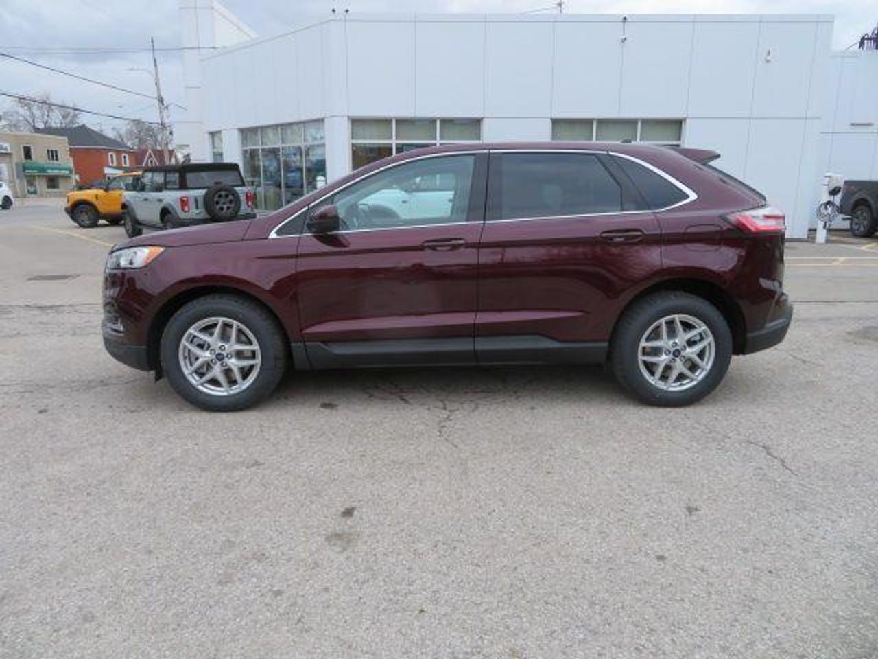 <p>Looking for a stylish and capable SUV that offers both comfort and convenience? Look no further than the new 2022 Ford Edge SEL at Heaslip Ford! This sleek crossover boasts a striking BURGUNDY VELVET MET exterior, complimented by an elegant EBONY ACTIVEX SEATS interior. With its spacious and versatile cabin, youll be able to comfortably carry your passengers and all your gear.</p><p>The Edge SEL is packed with features to make your drives enjoyable and safe. From the powerful EcoBoost engine to the advanced Ford Co-Pilot360 safety suite, this vehicle has it all. The Edge SEL also offers convenience features like a power liftgate, heated side mirrors, and a remote start system.</p><p>Here are five features that will really make this vehicle stand out:</p><ul><li><strong>Ford Co-Pilot360:</strong> This suite of driver-assist technologies includes features like Blind Spot Information System, Pre-Collision Assist with Automatic Emergency Braking, and Cross-Traffic Alert, helping you stay safe on the road.</li><li><strong>Power Liftgate:</strong> Effortlessly open and close your cargo area with the push of a button.</li><li><strong>Heated Side Mirrors:</strong> Stay comfortable even in the coldest weather with heated side mirrors.</li><li><strong>EcoBoost Engine:</strong> The Twin-Scroll 2.0L EcoBoost engine delivers both power and efficiency, making it ideal for both city driving and highway adventures.</li><li><strong>Panoramic Sunroof:</strong> Enjoy a bright and airy cabin with the panoramic sunroof.</li></ul><p>Dont miss out on the opportunity to experience the new Ford Edge SEL. Visit Heaslip Ford today for a test drive!</p><p><em>Powered by AutoIntelligence&trade; AI</em></p>