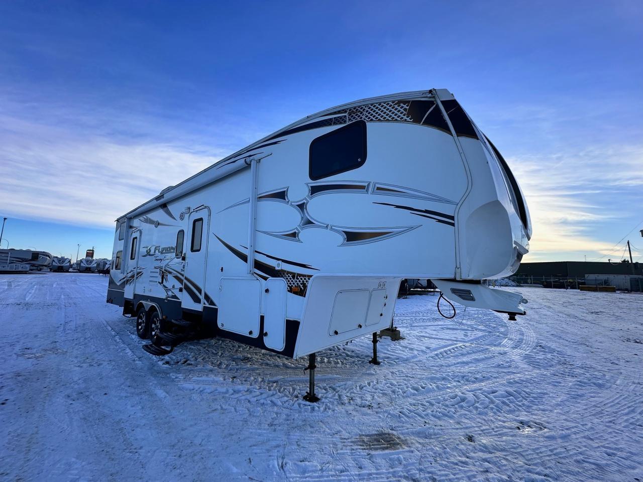 <p>Solid Surface Countertops</p><p>10 Cu Ft Fridge</p><p>Ice Maker</p><p>10 Garage</p><p>Garage Heater</p><p>Built In Flush Mount Wheel Chocks in Garage</p><p>Flush Mounted Steel Storage Compartments</p><p>Electric Ramp Door</p><p>Remote Controlled Slide Outs</p><p>Front & Rear Jacks</p><p>20 Electric Awning</p><p>Pin Box Cover w/Integrated Hitch Vision Mirror</p><p>Trail Air Suspension</p><p>35k BTU Furnace</p><p>7 Garage Door</p><p>Dual Electric Rear Lift Beds</p><p>Separate Side Entry In Garage</p><p>Sliding Patio Doors</p><p>15,000 BTU Ducted Air Conditioning</p><p>3 Burner Range</p><p>Microwave</p><p>Ceiling Fan</p><p>Residential Queen Mattress</p><p>30 gal Fuel Station</p><p>12 gal Gas/Elec Water Heater</p><p>Battery Disconnect</p><p>Heated & Enclosed Holding Tanks</p><p>2 150W Solar Panels</p><p>1000W Inverter</p>