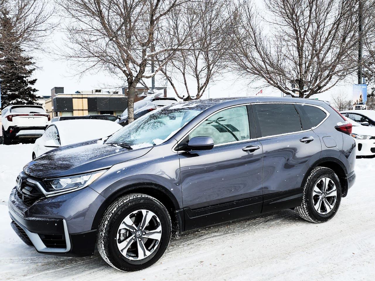Recent Arrival! Odometer is 36809 kilometers below market average! Gray 2021 Honda CR-V LX AWD CVT 1.5L I4 Turbocharged DOHC 16V LEV3-ULEV50 190hpAWD, 17 Aluminum Alloy Wheels, 4 Speakers, 4-Wheel Disc Brakes, 5.64 Axle Ratio, ABS brakes, Adaptive Cruise Control: Adaptive Cruise Control (ACC) with Low-Speed Follow, Air Conditioning, Alloy wheels, AM/FM radio, Apple CarPlay/Android Auto, Auto High-beam Headlights, Automatic temperature control, Brake assist, Bumpers: body-colour, Delay-off headlights, Driver door bin, Driver vanity mirror, Dual front impact airbags, Dual front side impact airbags, Electronic Stability Control, Exterior Parking Camera Rear, Fabric Seating Surfaces, Forward collision: Collision Mitigation Braking System (CMBS) + FCW mitigation, Four wheel independent suspension, Front anti-roll bar, Front Bucket Seats, Front dual zone A/C, Front reading lights, Heated door mirrors, Heated Front Bucket Seats, Heated front seats, Illuminated entry, Low tire pressure warning, Occupant sensing airbag, Outside temperature display, Overhead airbag, Overhead console, Panic alarm, Passenger door bin, Passenger vanity mirror, Power door mirrors, Power steering, Power windows, Radio data system, Radio: 160-Watt AM/FM Audio System, Rear anti-roll bar, Rear window defroster, Rear window wiper, Remote keyless entry, Security system, Speed control, Speed-sensing steering, Split folding rear seat, Spoiler, Steering wheel mounted audio controls, Tachometer, Telescoping steering wheel, Tilt steering wheel, Traction control, Trip computer.IN HOUSE FINANCING, IN HOUSE LEASING AVAILABLE O.A.C.If you are interested and need more information call or message our sales team, we will be glad to help you now!!Our knowledgeable sales staff will help assist you with every step. To book a test drive or receive further information give us a call at (780)-465-3535 or email us: kiahmed@gokia.caAt Go Kia, were happy to help! Proudly serving Edmonton and all of Alberta including St. Albert, Wetaskiwin, Fort McMurray, Grande Prairie, Drayton Valley, Nisku, Leduc, Rimby, Hinton, St. Paul, Lloydminster, Edson, and all of Western Canada!An AMVIC Licensed Business. Value Priced vehicles are aggressively priced and may require some additional mechanical or cosmetic repairs, all disclosed on a Vehicle Assessment Report!This vehicle may be leased or financed by anyone*, however, due to the recent increase in fraudulent vehicle purchase activity, Go Kia reserves the right to decline a transaction on suspicion of non-retail intentions including but not limited to wholesaling or exporting.*on approved credit, see dealer for details