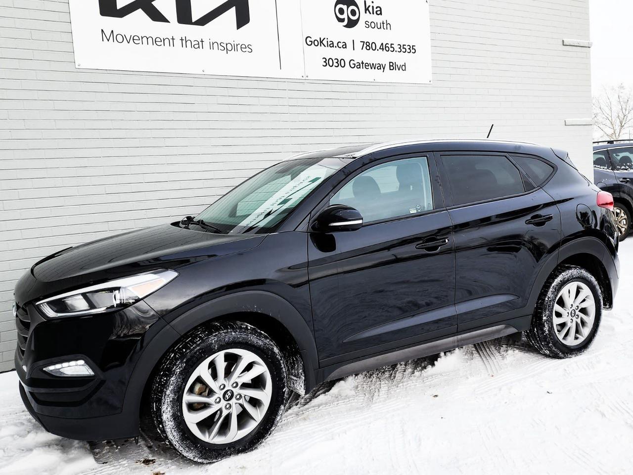 Awards: * IIHS Canada Top Safety Pick+, Top Safety Pick+ Recent Arrival! Ash Black 2016 Hyundai Tucson SE AWD 6-Speed Automatic with Overdrive 2.0L DOHCAWD, 4-Wheel Disc Brakes, ABS brakes, Air Conditioning, Alloy wheels, Anti-whiplash front head restraints, Brake assist, Delay-off headlights, Driver door bin, Driver vanity mirror, Dual front impact airbags, Dual front side impact airbags, Electronic Stability Control, Exterior Parking Camera Rear, Four wheel independent suspension, Front anti-roll bar, Front Bucket Seats, Front reading lights, Heated door mirrors, Illuminated entry, Occupant sensing airbag, Overhead airbag, Overhead console, Panic alarm, Passenger door bin, Passenger vanity mirror, Power door mirrors, Power steering, Power windows, Rear anti-roll bar, Rear window defroster, Rear window wiper, Remote keyless entry, Security system, Speed control, Speed-sensing steering, Split folding rear seat, Spoiler, Steering wheel mounted audio controls, Tachometer, Telescoping steering wheel, Tilt steering wheel, Traction control, Trip computer, Variably intermittent wipers.Reviews: * Most owners say this era of Tucson attracted their attention with unique exterior styling, and sealed the deal with a great balance of comfortable ride quality and sporty, spirited driving dynamics. Bang-for-the-buck was highly rated as well. Source: autoTRADER.caIN HOUSE FINANCING, IN HOUSE LEASING AVAILABLE O.A.C.If you are interested and need more information call or message our sales team, we will be glad to help you now!!Our knowledgeable sales staff will help assist you with every step. To book a test drive or receive further information give us a call at (780)-465-3535 or email us: kiahmed@gokia.caAt Go Kia, were happy to help! Proudly serving Edmonton and all of Alberta including St. Albert, Wetaskiwin, Fort McMurray, Grande Prairie, Drayton Valley, Nisku, Leduc, Rimby, Hinton, St. Paul, Lloydminster, Edson, and all of Western Canada!An AMVIC Licensed Business. Value Priced vehicles are aggressively priced and may require some additional mechanical or cosmetic repairs, all disclosed on a Vehicle Assessment Report!This vehicle may be leased or financed by anyone*, however, due to the recent increase in fraudulent vehicle purchase activity, Go Kia reserves the right to decline a transaction on suspicion of non-retail intentions including but not limited to wholesaling or exporting.*on approved credit, see dealer for details