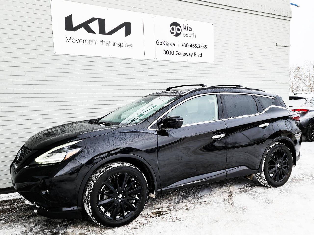 Recent Arrival! Odometer is 10153 kilometers below market average! Black 2021 Nissan Murano SL AWD CVT with Xtronic 3.5L 6-Cylinder DOHC 24VCVT with Xtronic, AWD, 11 Speakers, 4.677 Axle Ratio, 4-Wheel Disc Brakes, ABS brakes, Air Conditioning, Alloy wheels, AM/FM radio: SiriusXM, Auto High-beam Headlights, Auto-dimming Rear-View mirror, Automatic temperature control, Blind Spot Warning, Brake assist, Bumpers: body-colour, CD player, Child-Seat-Sensing Airbag, Compass, Delay-off headlights, Driver door bin, Driver vanity mirror, Dual front impact airbags, Dual front side impact airbags, Electronic Stability Control, Four wheel independent suspension, Front anti-roll bar, Front Bucket Seats, Front dual zone A/C, Front fog lights, Front reading lights, Full Tank of Fuel & Floor Mats, Fully automatic headlights, Garage door transmitter: HomeLink, Heated door mirrors, Heated Front Bucket Seats, Heated front seats, Heated rear seats, Heated steering wheel, Illuminated entry, Knee airbag, Leather Appointed Seat Trim, Low tire pressure warning, Memory seat, Navigation system: NissanConnect Navigation, NissanConnect featuring Apple CarPlay and Android Auto, Occupant sensing airbag, Outside temperature display, Overhead airbag, Overhead console, Panic alarm, Passenger door bin, Passenger vanity mirror, Power door mirrors, Power driver seat, Power Liftgate, Power moonroof, Power passenger seat, Power steering, Power windows, Radio data system, Radio: AM/FM/CD/MP3/WMA NissanConnect w/Navigation, Rear anti-roll bar, Rear reading lights, Rear side impact airbag, Rear window defroster, Rear window wiper, Remote keyless entry, Roof rack: rails only, Security system, Speed control, Speed-sensing steering, Speed-Sensitive Wipers, Split folding rear seat, Spoiler, Steering wheel mounted audio controls, Tachometer, Telescoping steering wheel, Tilt steering wheel, Traction control, Trip computer, Turn signal indicator mirrors, Variably intermittent wipers.IN HOUSE FINANCING, IN HOUSE LEASING AVAILABLE O.A.C.If you are interested and need more information call or message our sales team, we will be glad to help you now!!Our knowledgeable sales staff will help assist you with every step. To book a test drive or receive further information give us a call at (780)-465-3535 or email us: kiahmed@gokia.caAt Go Kia, were happy to help! Proudly serving Edmonton and all of Alberta including St. Albert, Wetaskiwin, Fort McMurray, Grande Prairie, Drayton Valley, Nisku, Leduc, Rimby, Hinton, St. Paul, Lloydminster, Edson, and all of Western Canada!An AMVIC Licensed Business. Value Priced vehicles are aggressively priced and may require some additional mechanical or cosmetic repairs, all disclosed on a Vehicle Assessment Report!This vehicle may be leased or financed by anyone*, however, due to the recent increase in fraudulent vehicle purchase activity, Go Kia reserves the right to decline a transaction on suspicion of non-retail intentions including but not limited to wholesaling or exporting.*on approved credit, see dealer for details