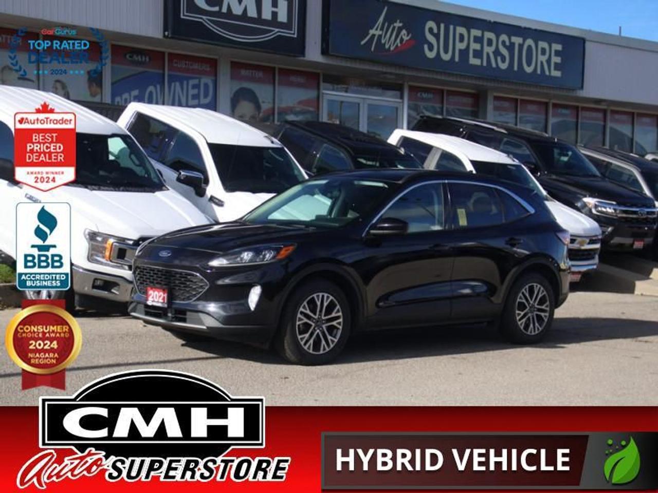 <b>HYBRID AWD !! FORD CO-PILOT360 ASSIST+ !! NAVIGATION, REAR CAMERA, ADAPTIVE CRUISE, LANE KEEPING, COLLISION SENSORS, BLIND SPOT, APPLE CARPLAY, PANORAMIC SUNROOF, LEATHER, POWER SEAT, HEATED SEATS/STEERING WHEEL, POWER LIFTGATE, REMOTE START, 18-IN ALLOYS</b><br>  <br>CMH certifies that all vehicles meet DOUBLE the Ministry standards for Brakes and Tires<br><br> <br>    This  2021 Ford Escape is for sale today. <br> <br>The Ford Escape was built for an active lifestyle and offers plenty of options for you to hit the road in your own individual style. Whether you need a family SUV for soccer practice, a capable adventure vehicle, or both, the versatile Ford Escape has you covered. Built for those who live on the go, the Ford Escape was made to be unstoppable.This  SUV has 84,315 kms. Its  black in colour  and is major accident free based on the <a href=https://vhr.carfax.ca/?id=08VdAignxNV8wlcPz+5R6ibuL2F6LwB1 target=_blank>CARFAX Report</a> . It has an automatic transmission and is powered by a  200HP 2.5L 4 Cylinder Engine. <br> <br> Our Escapes trim level is SEL Hybrid. Upgrading to this Ford Escape SEL Hybrid is a wise choice as it comes loaded with heated seats and a power driver seat with premium ActiveX material, unique aluminum wheels and Fords SYNC 3 infotainment system complete with a large touchscreen, Apple CarPlay and Android Auto. Additional features include a power rear liftgate, heated leatherette steering wheel, SiriusXM radio, FordPass Connect 4G LTE, automatic climate control, a smart device remote starter, plus exterior chrome accents. For added convenience and safety this Ford Escape also comes with a 60-40 split-folding rear seat, remote keyless entry with a proximity key, plus Ford Co-Pilot360 that features lane keep assist, a rear view camera with rear parking sensors, blind spot detection, automatic emergency braking and cross traffic alert.<br> To view the original window sticker for this vehicle view this <a href=http://www.windowsticker.forddirect.com/windowsticker.pdf?vin=1FMCU9CZ9MUA15106 target=_blank>http://www.windowsticker.forddirect.com/windowsticker.pdf?vin=1FMCU9CZ9MUA15106</a>. <br/><br> <br>To apply right now for financing use this link : <a href=https://www.cmhniagara.com/financing/ target=_blank>https://www.cmhniagara.com/financing/</a><br><br> <br/><br>Trade-ins are welcome! Financing available OAC ! Price INCLUDES a valid safety certificate! Price INCLUDES a 60-day limited warranty on all vehicles except classic or vintage cars. CMH is a Full Disclosure dealer with no hidden fees. We are a family-owned and operated business for over 30 years! o~o