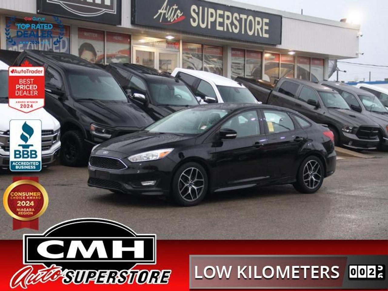<b>ONLY 72,000 KMS !! AUTOMATIC SEDAN !! REAR CAMERA, BLUETOOTH, STEERING WHEEL CONTROLS, PADDLE SHIFTERS, CRUISE CONTROL, HEATED FRONT SEATS, HEATED STEERING WHEEL, HEATED MIRRORS, REAR SPOILER, POWER GROUP, A/C, 17-INCH ALLOY WHEELS</b><br>  <br>CMH certifies that all vehicles meet DOUBLE the Ministry standards for Brakes and Tires<br><br> <br>    This  2018 Ford Focus is for sale today. <br> <br>Most compact cars focus on value and efficiency, but this Ford Focus adds a fun to drive factor that comes as a pleasant surprise. An attractive car inside and out, the Ford Focus is a standout in a competitive segment. This low mileage  sedan has just 71,008 kms. Its  black in colour  and is major accident free based on the <a href=https://vhr.carfax.ca/?id=Fk+dwolAFKr0bgBQVSi40qHP4kMDsWLf target=_blank>CARFAX Report</a> . It has an automatic transmission and is powered by a   2.0L 4 Cylinder Engine. <br> <br> Our Focuss trim level is SE. The mid-range Focus SE is an excellent blend of features and value. It comes with SYNC and Bluetooth connectivity, an AM/FM CD/MP3 player with a USB port, a rearview camera, air conditioning, steering wheel-mounted audio and cruise control, aluminum wheels, remote keyless entry, and more.<br> To view the original window sticker for this vehicle view this <a href=http://www.windowsticker.forddirect.com/windowsticker.pdf?vin=1FADP3F22JL296569 target=_blank>http://www.windowsticker.forddirect.com/windowsticker.pdf?vin=1FADP3F22JL296569</a>. <br/><br> <br>To apply right now for financing use this link : <a href=https://www.cmhniagara.com/financing/ target=_blank>https://www.cmhniagara.com/financing/</a><br><br> <br/><br>Trade-ins are welcome! Financing available OAC ! Price INCLUDES a valid safety certificate! Price INCLUDES a 60-day limited warranty on all vehicles except classic or vintage cars. CMH is a Full Disclosure dealer with no hidden fees. We are a family-owned and operated business for over 30 years! o~o