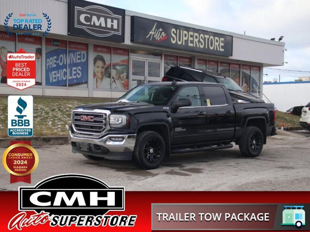<b>V8 4X4 !! CREW CAB !! REAR CAMERA, APPLE CARPLAY, ANDROID AUTO, TOUCH DISPLAY SCREEN, STEERING WHEEL CONTROLS, CRUISE CONTROL, POWER DRIVER SEAT, DUAL CLIMATE CONTROL, REMOTE START, SPRAY LINER, TOWING CONTROLLER, 18-INCH ALLOYS W/ BLACK PLASTIC COVERS</b><br>  <br>CMH certifies that all vehicles meet DOUBLE the Ministry standards for Brakes and Tires<br><br> <br>    This  2018 GMC Sierra 1500 is for sale today. <br> <br>This 2018 GMC Sierras expertly crafted body and premium materials form a striking appearance inside and out. Thanks to its stunning GMC Signature LED lighting that further enhance its bold and advanced design, this Sierra offers a Professional Grade truck thats built for anything you put in front of it. One look inside this handsome truck and youll find premium materials such as a soft-touch instrument panel, superior comfort in its seats, and advanced safety features making the Sierra, an all around complete package. This  Crew Cab 4X4 pickup  has 186,136 kms. Its  black in colour  and is completely accident free based on the <a href=https://vhr.carfax.ca/?id=a04jDL9G225Lc6stFVTdtvaQhEGk6Q7h target=_blank>CARFAX Report</a> . It has an automatic transmission and is powered by a  355HP 5.3L 8 Cylinder Engine. <br> <br> Our Sierra 1500s trim level is SLE. Moving a step above the base Sierra, this GMC 1500 SLE is well worth the extra money and includes many useful features. These extras include aluminum wheels, an EZ lift and lower tailgate, 8 inch colour touchscreen with bluetooth audio streaming and a rear vision camera, an upgraded stereo, remote keyless entry and power windows. <br> <br>To apply right now for financing use this link : <a href=https://www.cmhniagara.com/financing/ target=_blank>https://www.cmhniagara.com/financing/</a><br><br> <br/><br>Trade-ins are welcome! Financing available OAC ! Price INCLUDES a valid safety certificate! Price INCLUDES a 60-day limited warranty on all vehicles except classic or vintage cars. CMH is a Full Disclosure dealer with no hidden fees. We are a family-owned and operated business for over 30 years! o~o