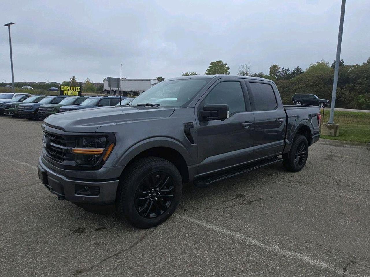 <p>Cruise the streets in style with the brand new 2025 Ford F-150 XLT from Expressway Motors Ltd.! This Carbonized Grey Metallic beauty is more than just a truck; its a statement. With the Black Appearance Package, this F-150 commands attention with its sleek, modern design. Inside, youll find a thoughtfully designed interior ready for work or play, and with its powerful 2.7L 6-cylinder engine and responsive automatic transmission, youll experience a smooth and capable ride, no matter the terrain.</p><p>Prepare to be impressed by the F-150s impressive features. Enjoy the open road with the Twin Panel Moonroof, allowing natural light and fresh air to fill the cabin. The trucks four-wheel drive capability ensures youre ready for anything, from city streets to off-road adventures.</p><p>Here are a few of the exciting features:</p><ul><li><strong>Black Appearance Package</strong>: Turn heads with a bold and modern aesthetic.</li><li><strong>Twin Panel Moonroof</strong>: Experience the open road and natural light.</li><li><strong>4-Wheel Drive</strong>: Tackle any terrain with confidence.</li><li><strong>Carbonized Grey Metallic Exterior</strong>: A sophisticated and eye-catching colour.</li><li><strong>2.7L 6-cylinder Engine</strong>: Powerful and efficient performance.</li></ul><p><strong><em>Powered by AutoIntelligence&trade;</em></strong> Vehicle information has been generated using artificial intelligence and is provided for informational purposes only. While efforts are made to ensure accuracy, please confirm all details directly with the dealer.</p>