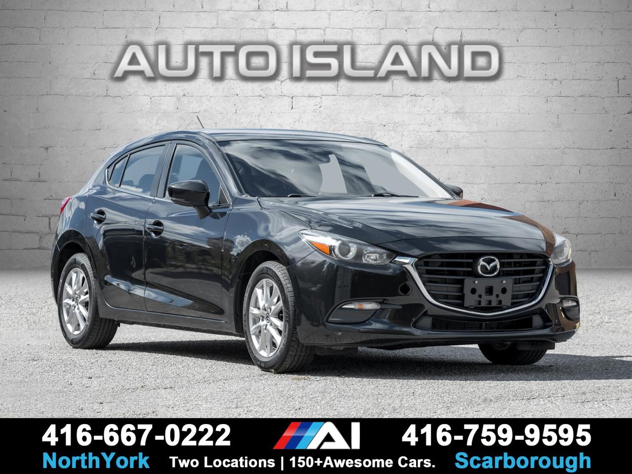 ACCIDENT-FREE, HEATED SEATS, HEATED STEERING WHEEL, BACKUP CAMERA, BLIND SPOT MONITORING, BLUETOOTH, ALLOY WHEELS.    This accident-free 2018 Mazda3 GS Hatchback delivers a sporty drive with practicality and comfort. Equipped with a heated front seats, and a heated steering wheel, it’s perfect for Canadian winters. Safety is enhanced with blind spot monitoring, a rearview camera, and advanced stability systems. The interior features a 7-inch Mazda Connect display with Bluetooth, and steering wheel audio control. Stylish alloy wheels and sharp hatchback design complete the package, making this Mazda3 GS a versatile, reliable, and fun-to-drive choice.         Auto Island Inc., North York  2555 Steeles Ave. West    www.autoislandinc.com     4.7 Google Rating and over 150 vehicles in stock, with more arriving daily! We take pride in offering top-quality vehicles and exceptional service. Our full-service mechanical shop is ready for all your maintenance needs, and every vehicle is professionally detailed and inspected – buy with confidence!    Payments as low as $0 down, up to 84 months, OAC. Good credit, bad credit, new credit? No problem – everyone’s approved! Easy online credit application available . Rates starting at 6.95% OAC – please call for details.    Please note: All prices are plus applicable taxes (HST) and licensing. No hidden surprises—just great vehicles and transparent deals. Certification is available for an additional $899. Without certification, as per OMVIC regulations, the vehicle is not drivable, not E-tested, and not certified.    Proudly serving the GTA and beyond: Peel, Halton, Brampton, Toronto, Burlington, Milton, Mississauga, Hamilton, Cambridge, London, Kitchener, Guelph, Orangeville, Newmarket, Barrie, Markham, Bolton, Caledon, Vaughan, Woodbridge, Etobicoke, Oakville, and more.    We carry all makes and models, including Mercedes, BMW, Audi, Jaguar, VW, Maserati, Porsche, Land Rover, Range Rover, Chrysler, Jeep, Honda, Toyota, Lexus, Infiniti, Acura, and more.